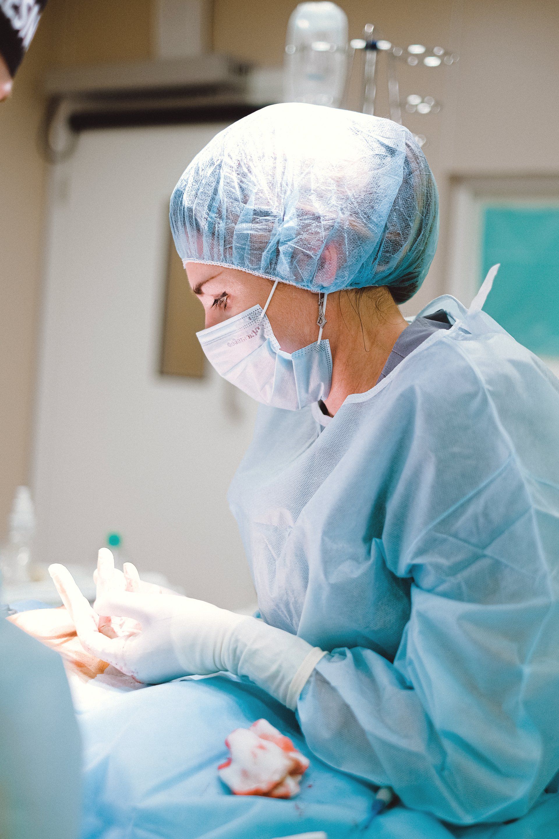 A picture of a hair transplant surgeon at work