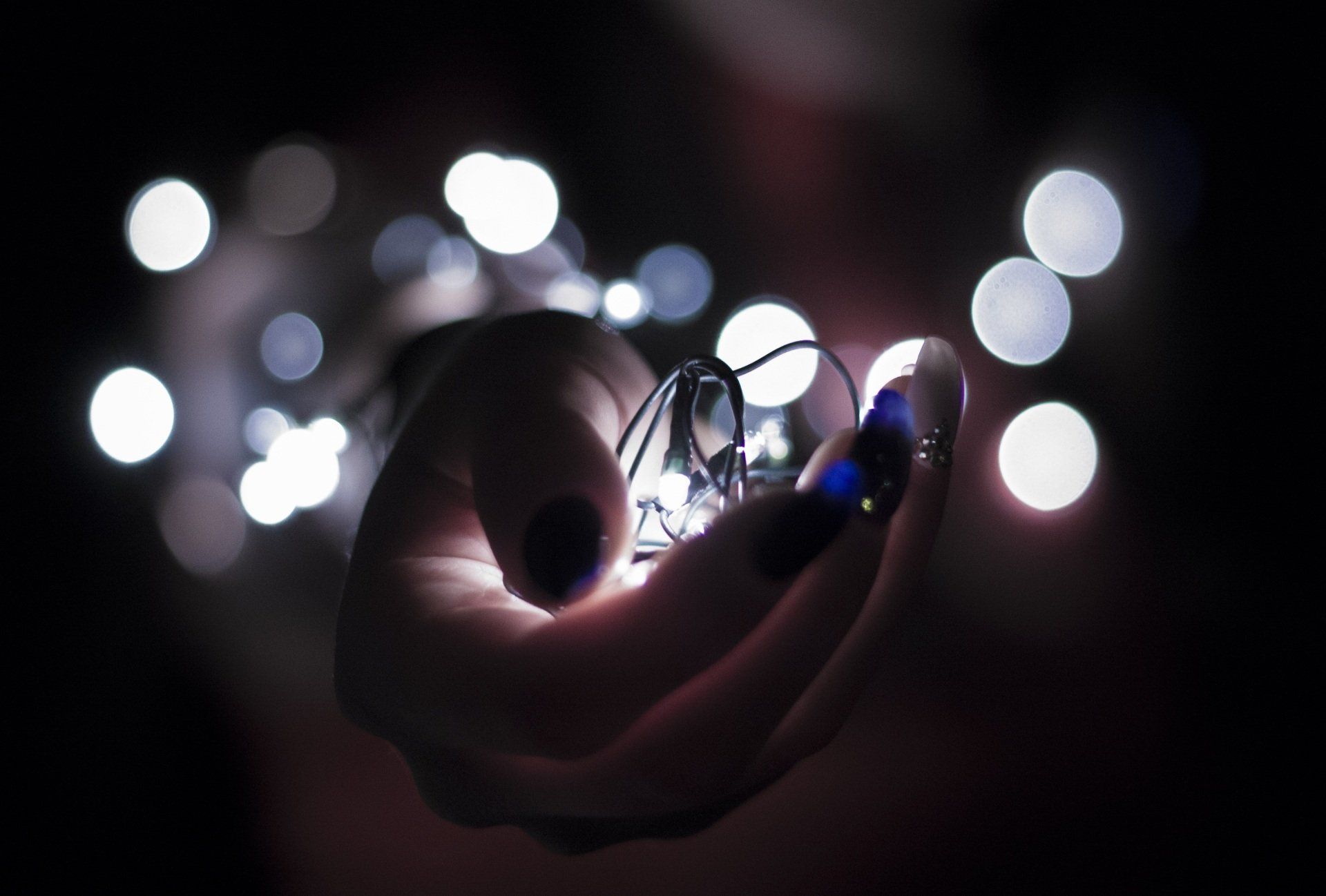 a hand holding lights