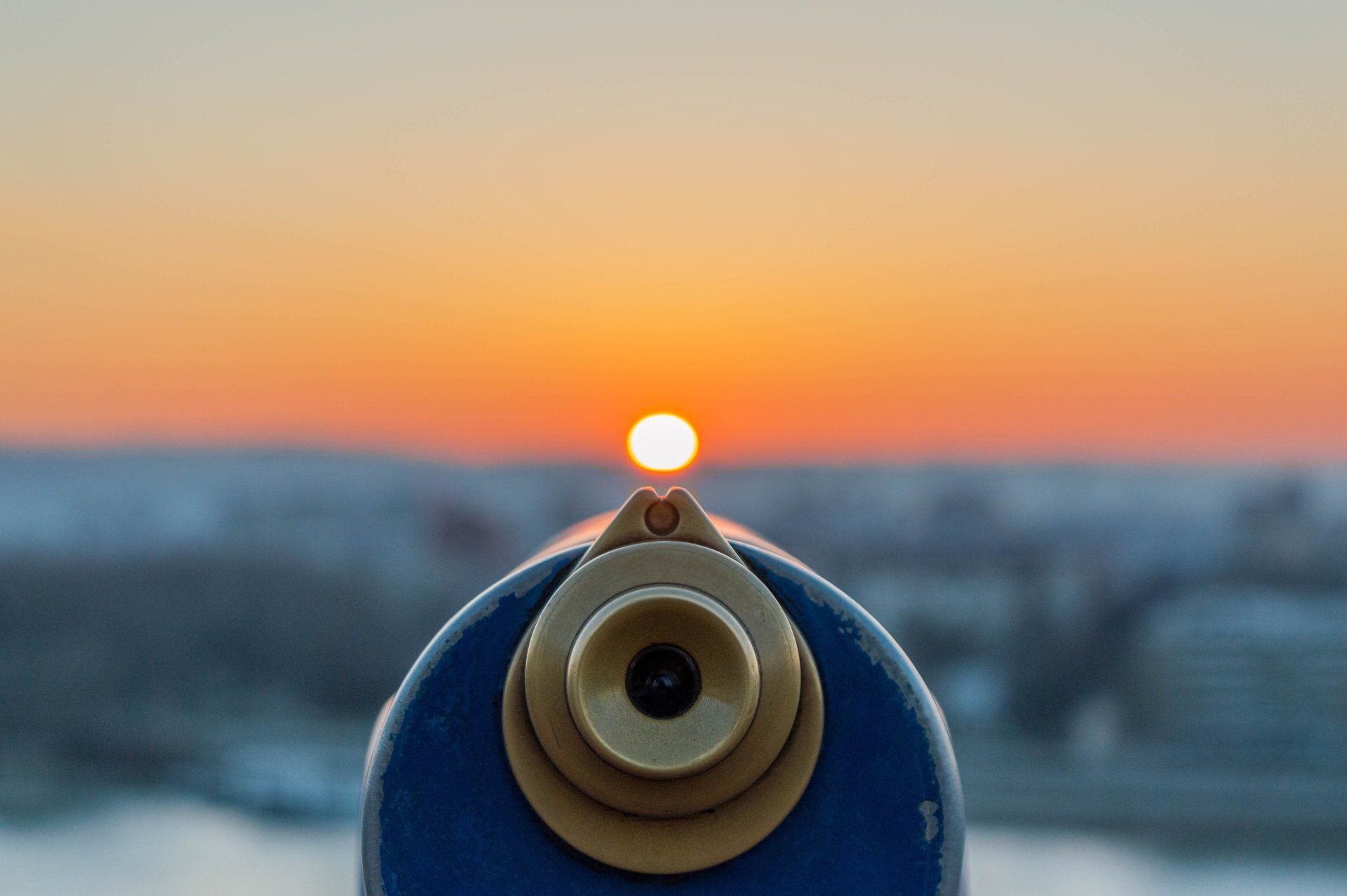A telescope pointing towards the sunset, reflecting the blog content on the simple power of noticing