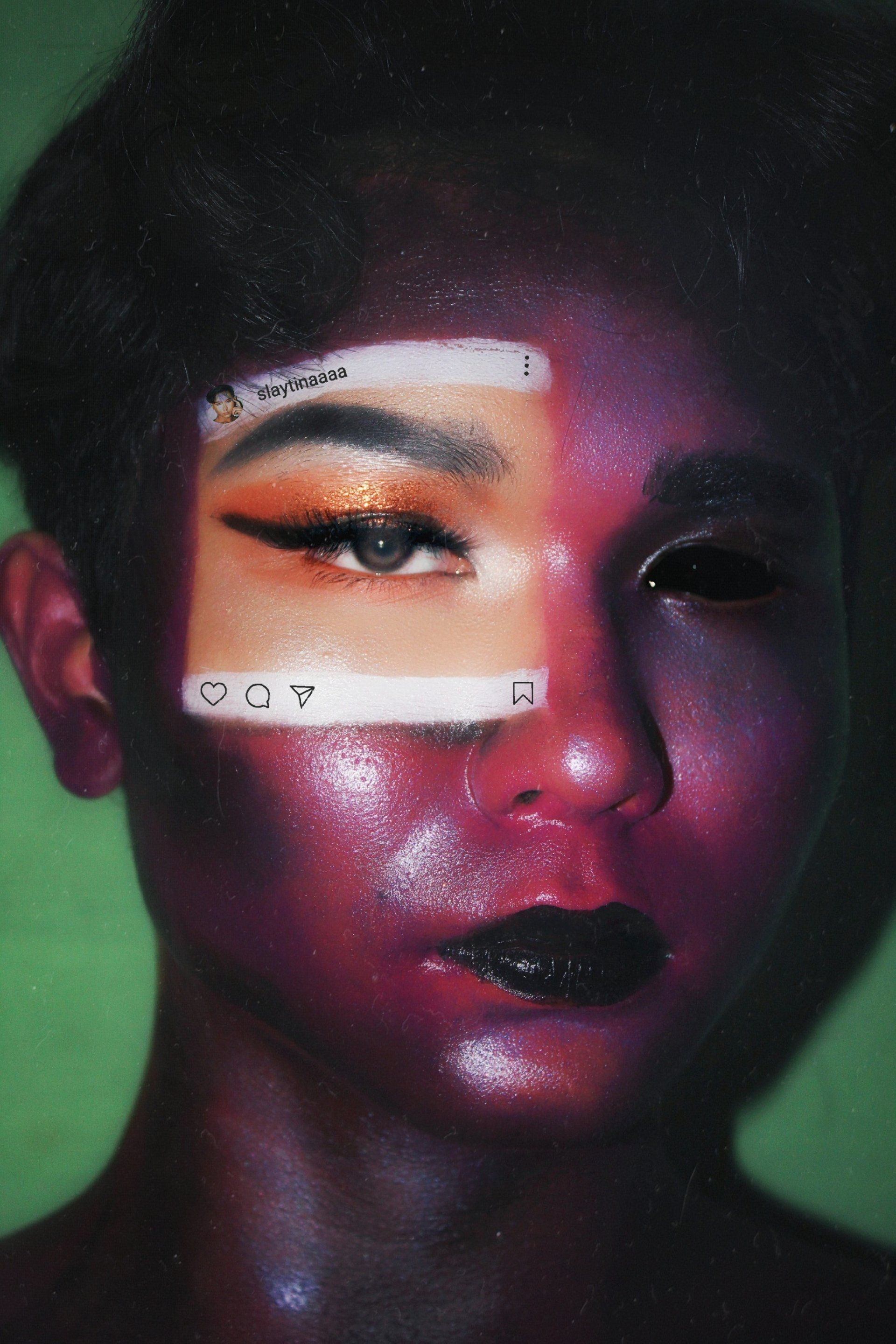 A close up of a person 's face with makeup on it.