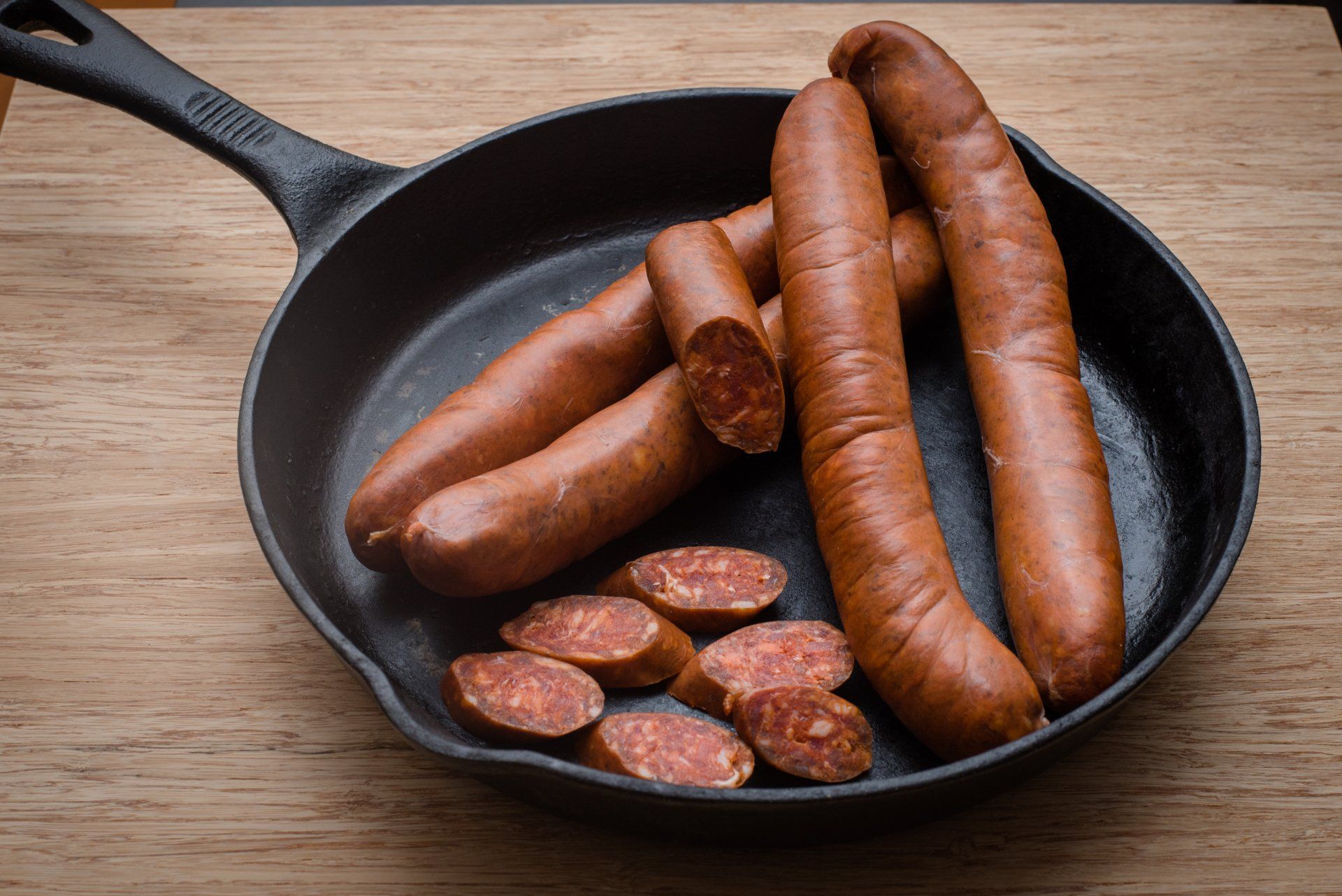 sausages on iron skillet