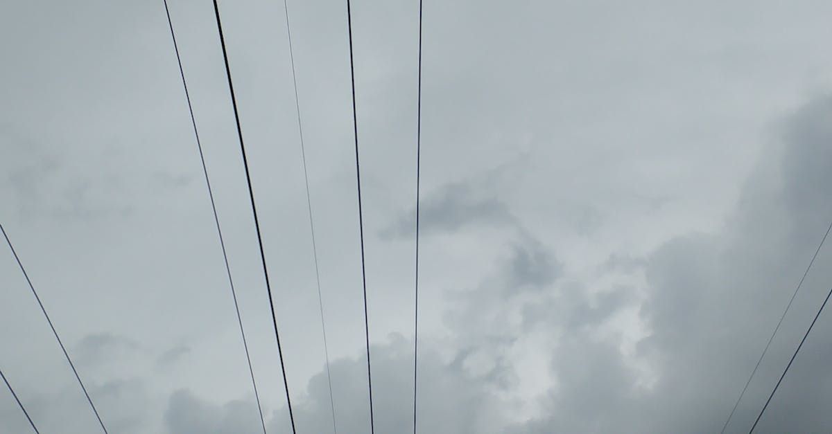 Power lines beneath stormy skies