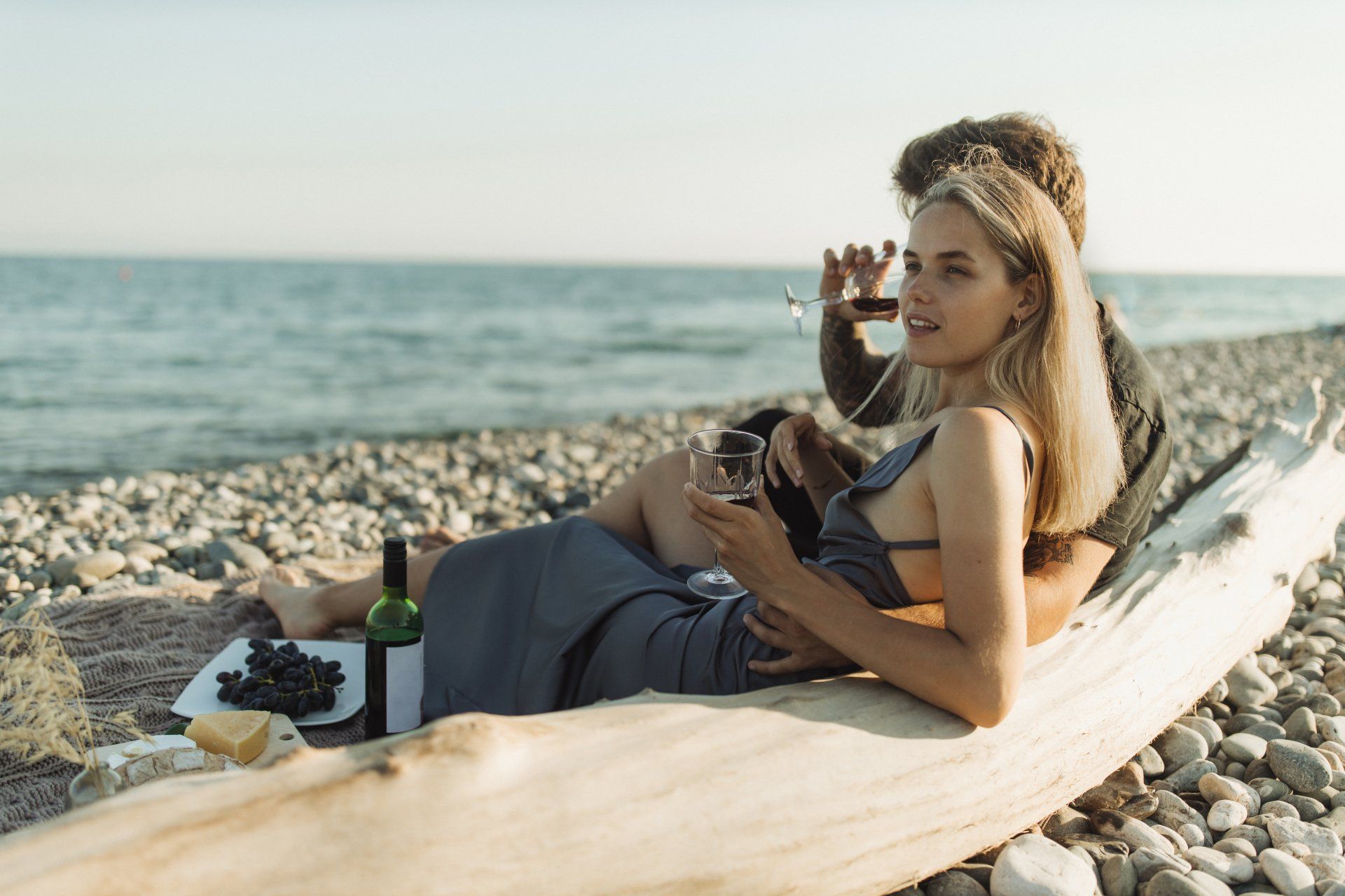 couple drinking wine on the beach
