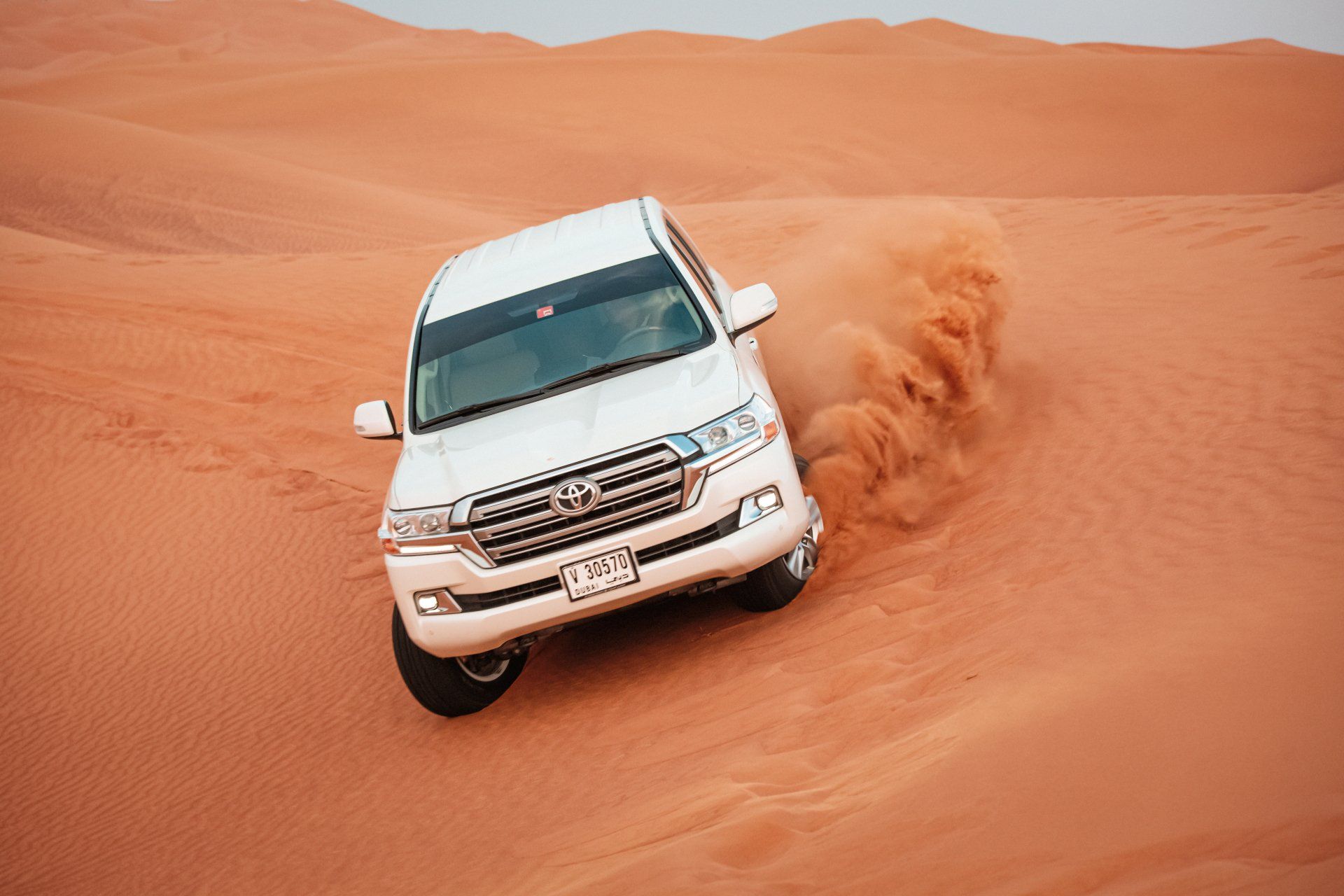 White Land Cruiser on Desert