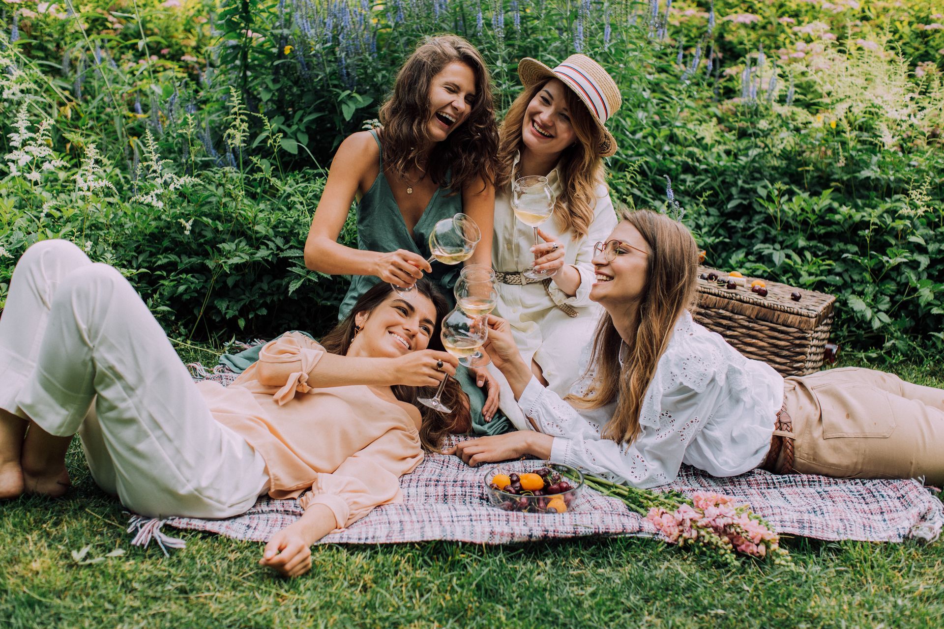 women enjoying wine and snacks