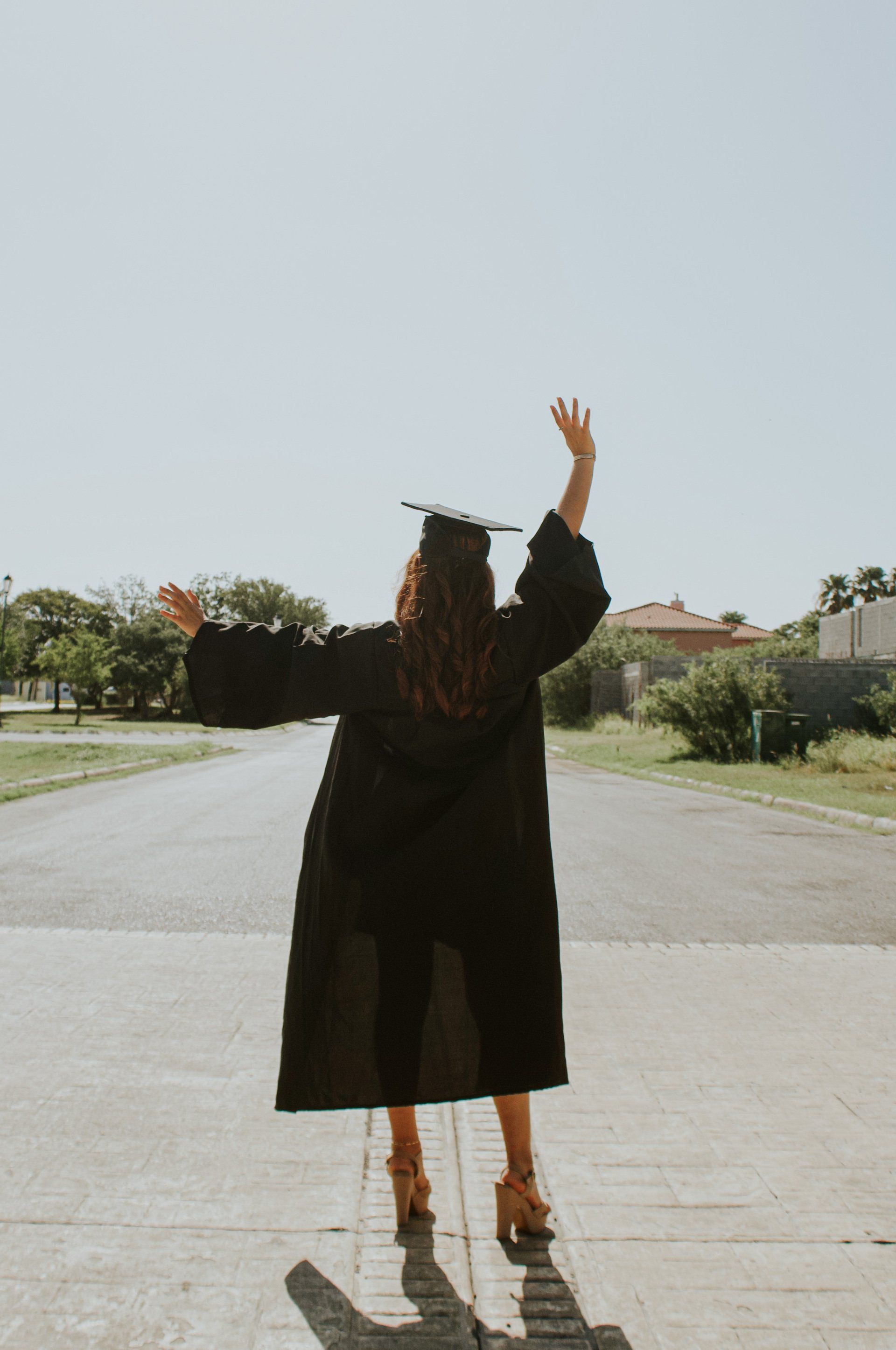 Collage student holding a degree in hand