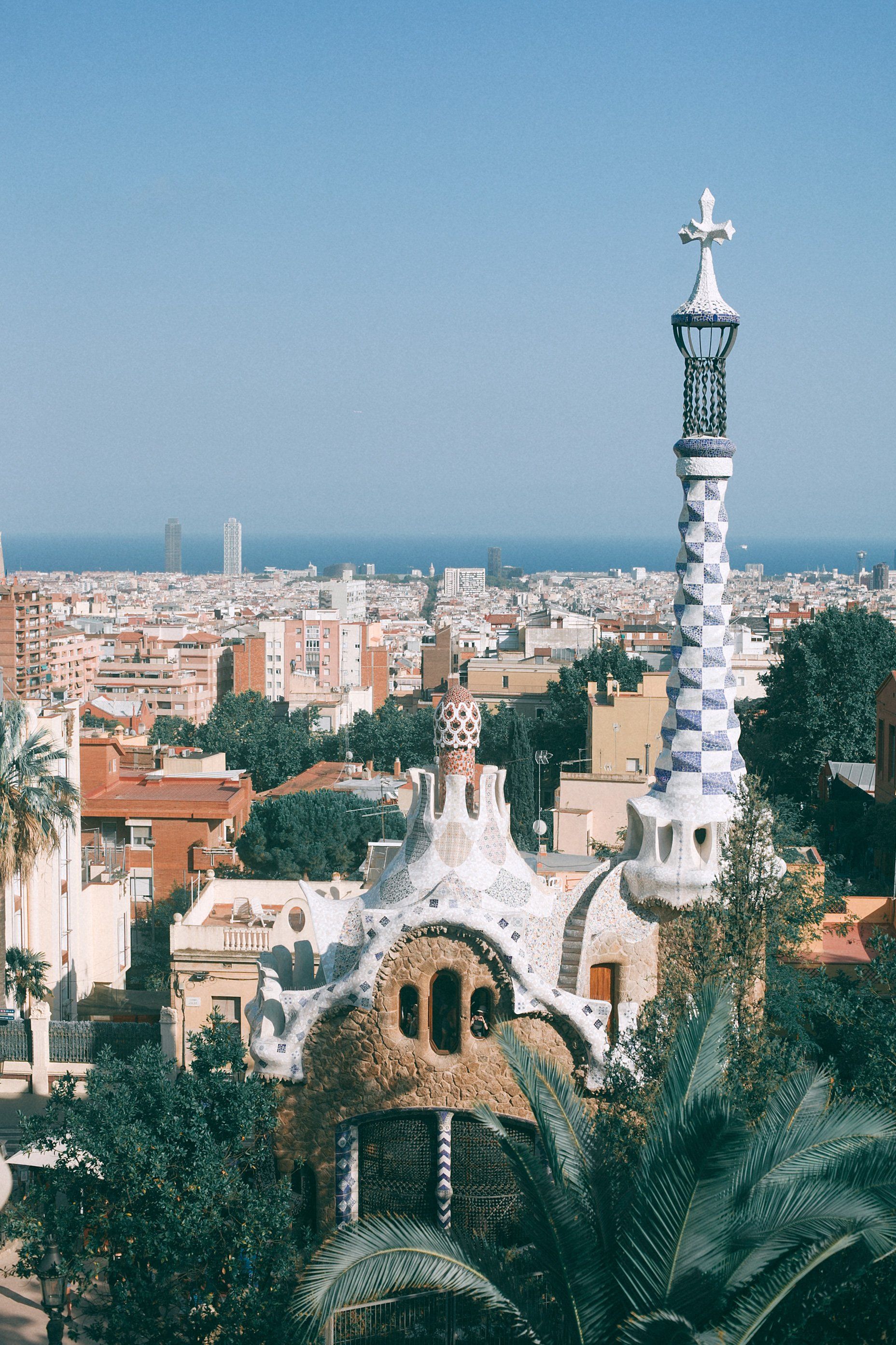 An aerial view of a city with a tower in the foreground