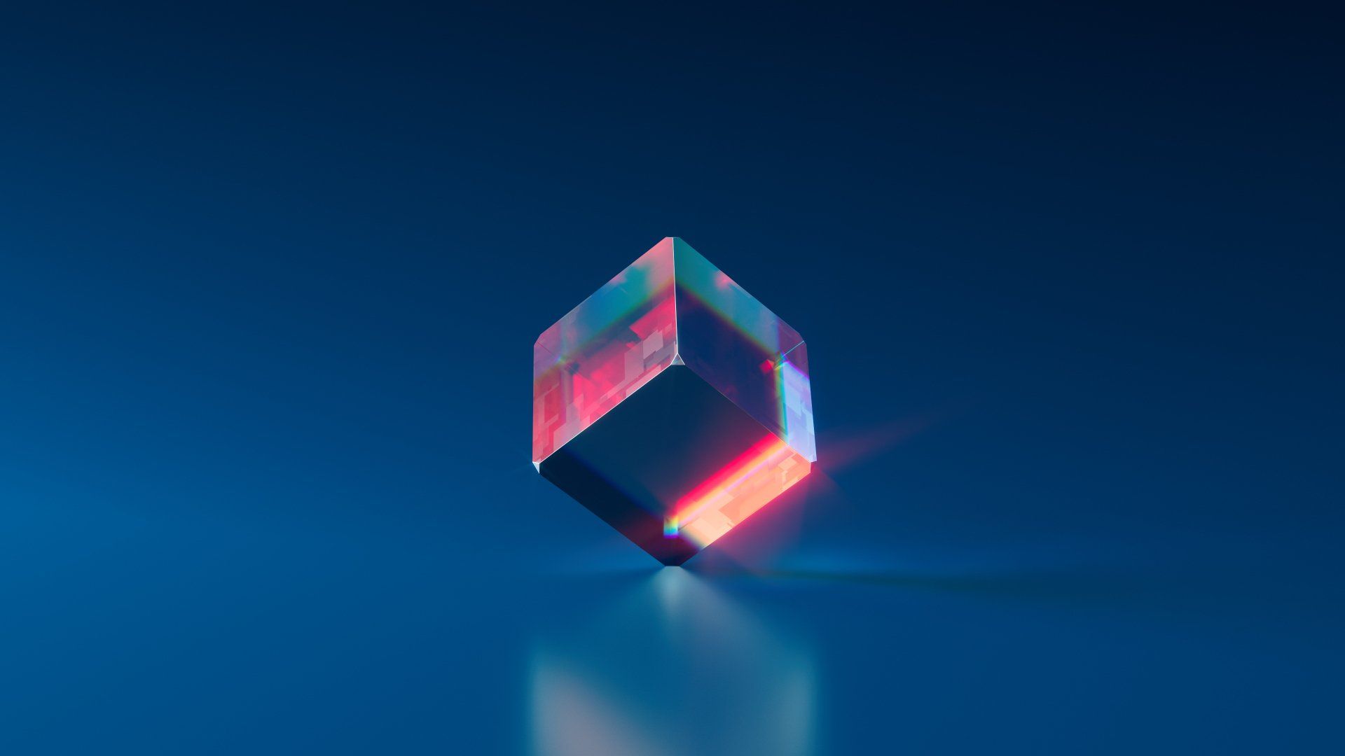 a red and blue cube is sitting on a blue surface 