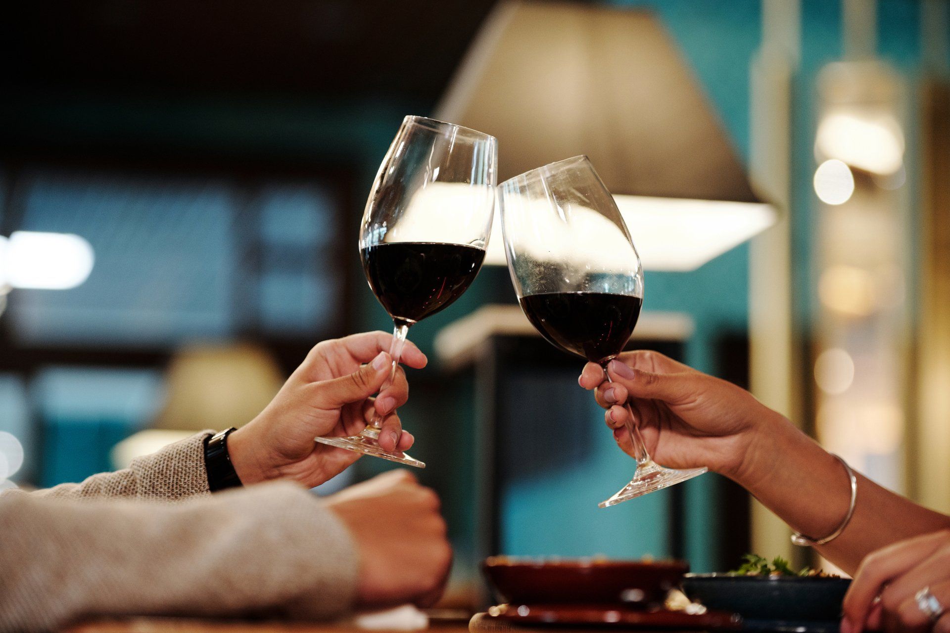 a row of wine glasses are lined up on a table .