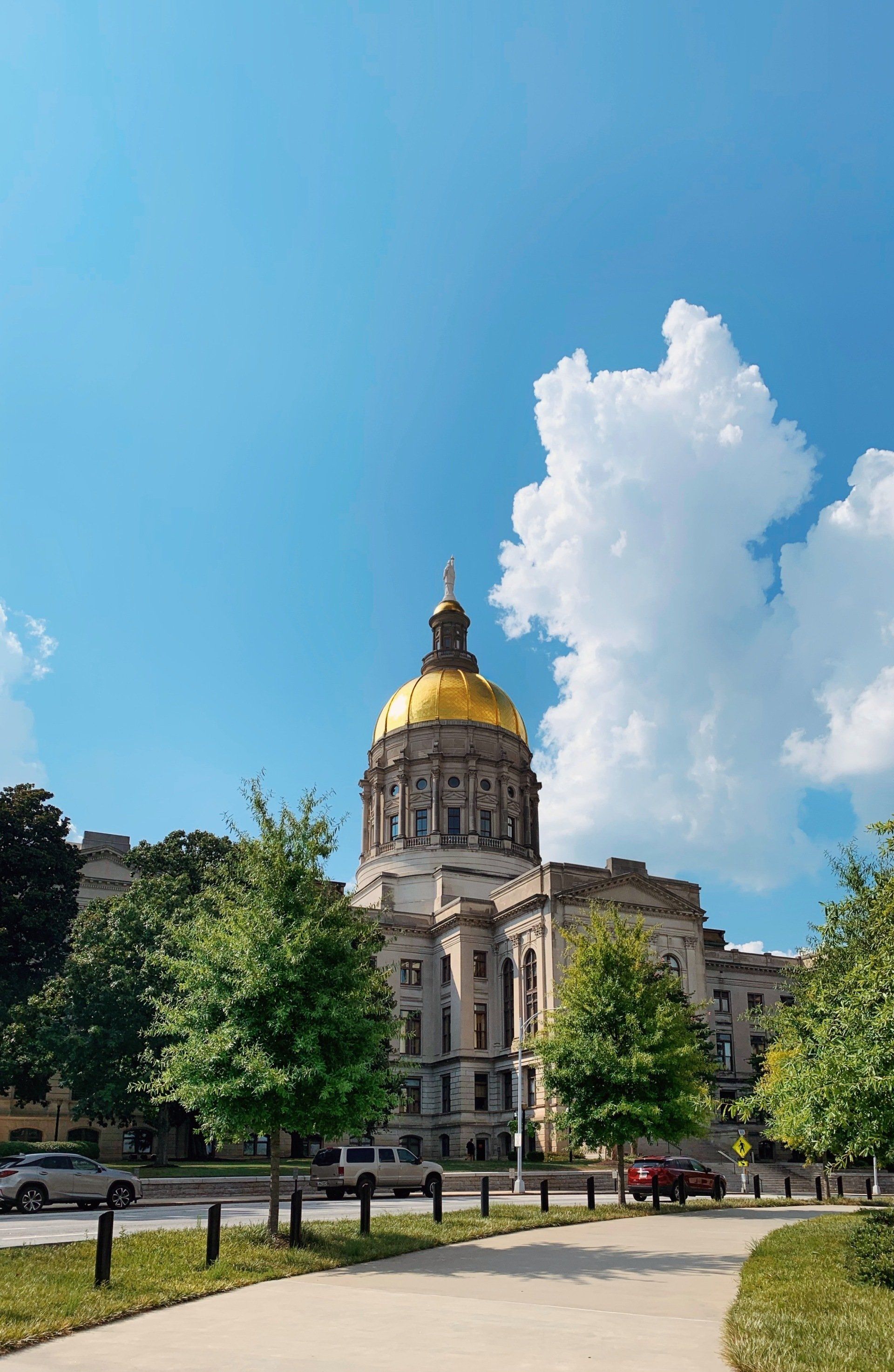 A large building with a gold dome on top of it.