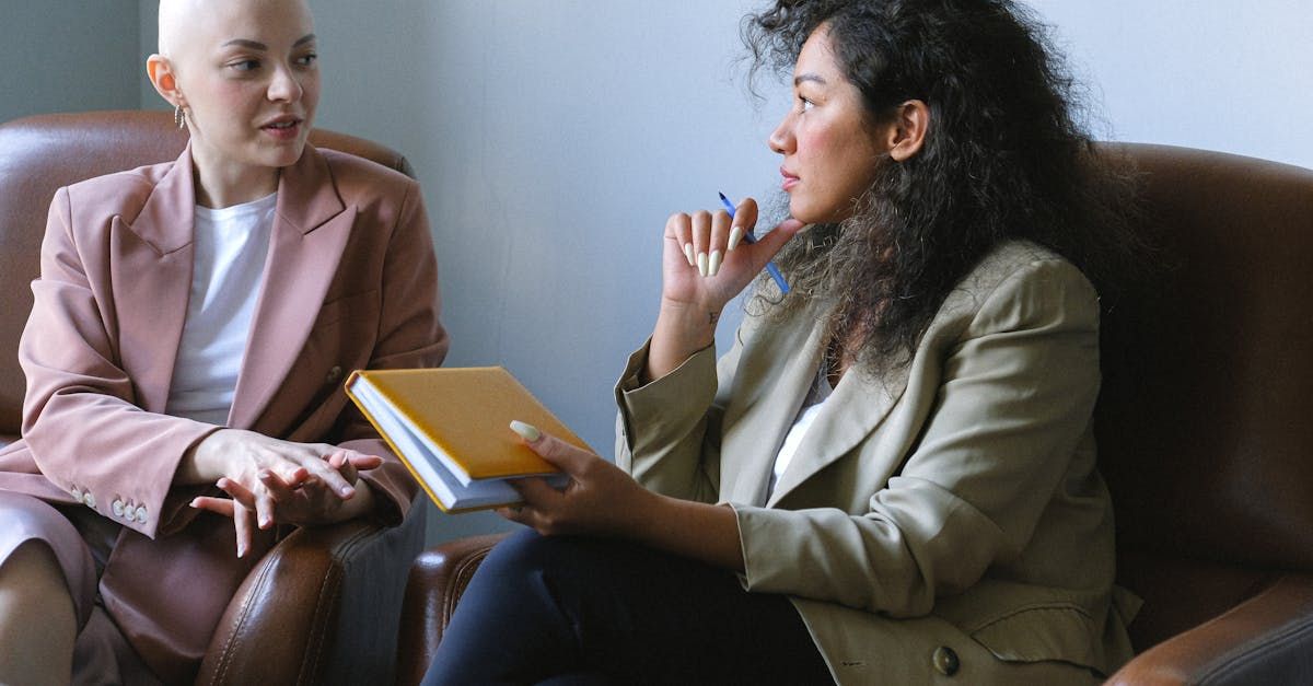 Two young females having a meeting