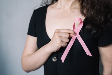 pink ribbon and cancer icon