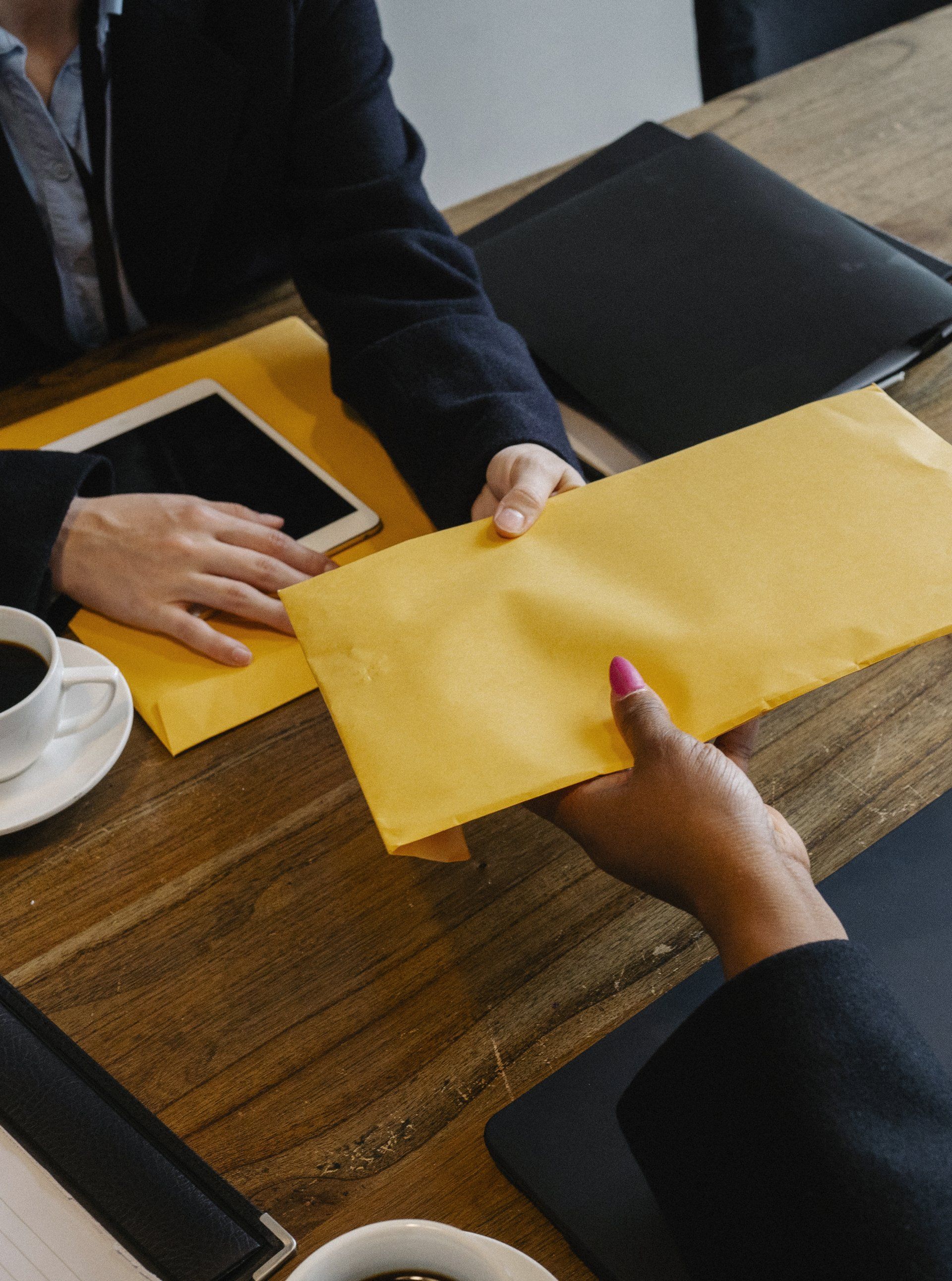 Handing a letter to a business colleague