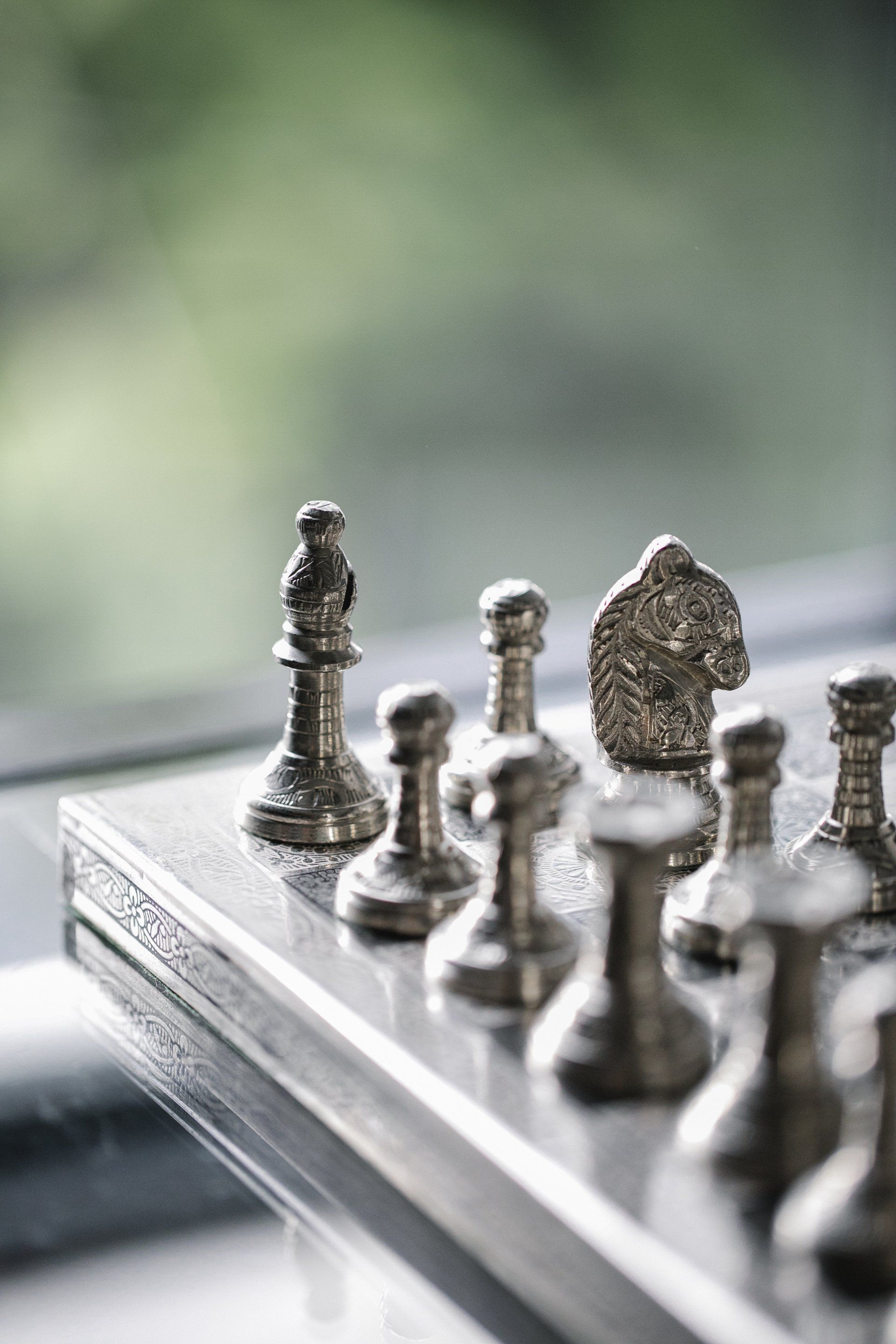 A close up of a chess set on a table.