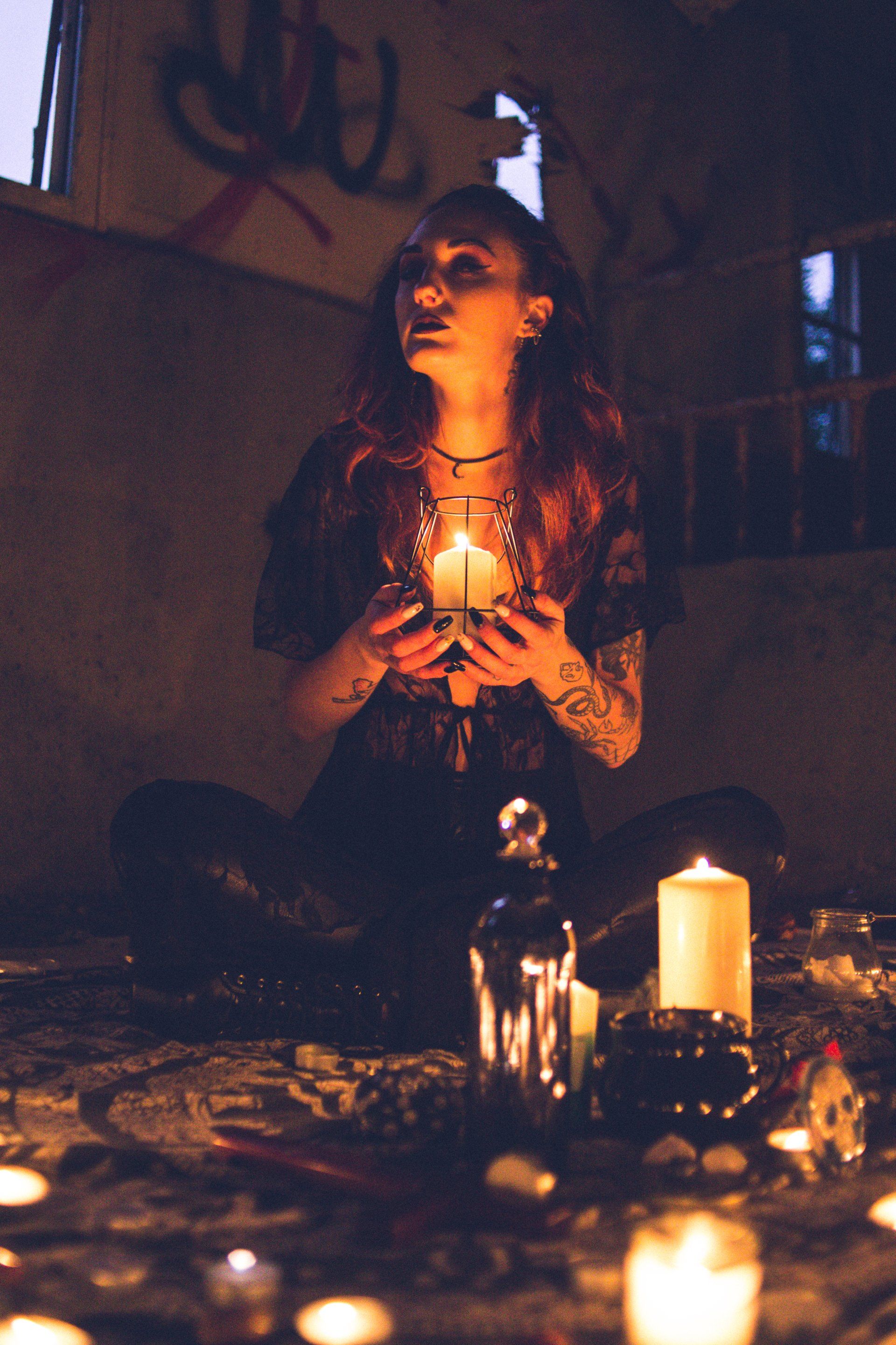 a woman holding a candle