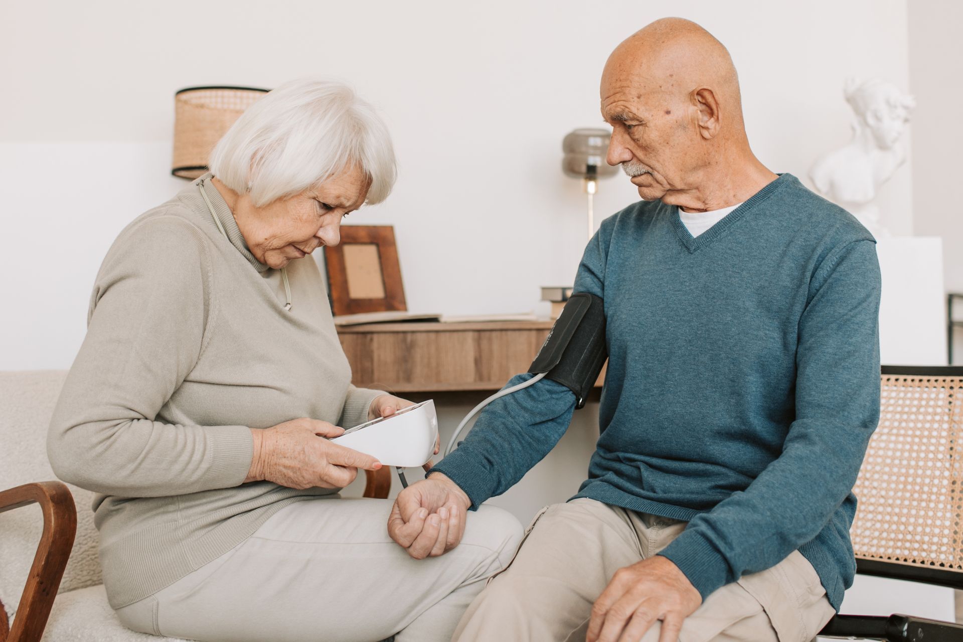 elderly couple taking blood pressure