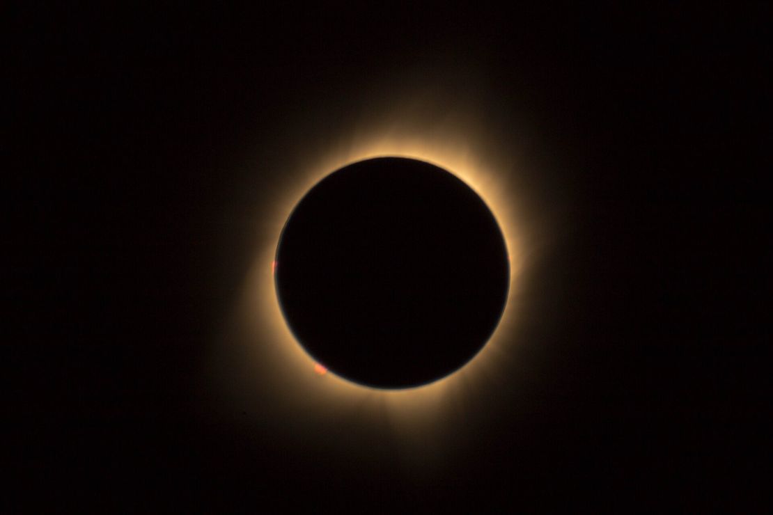 the moon is covering the sun during a total eclipse .