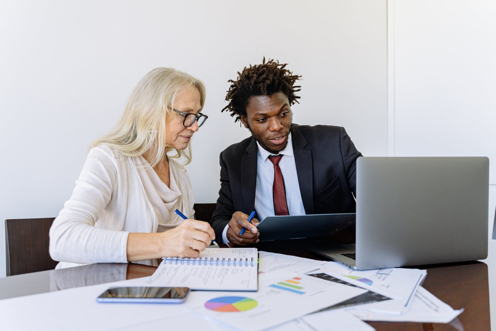 A man and women going over their finances>