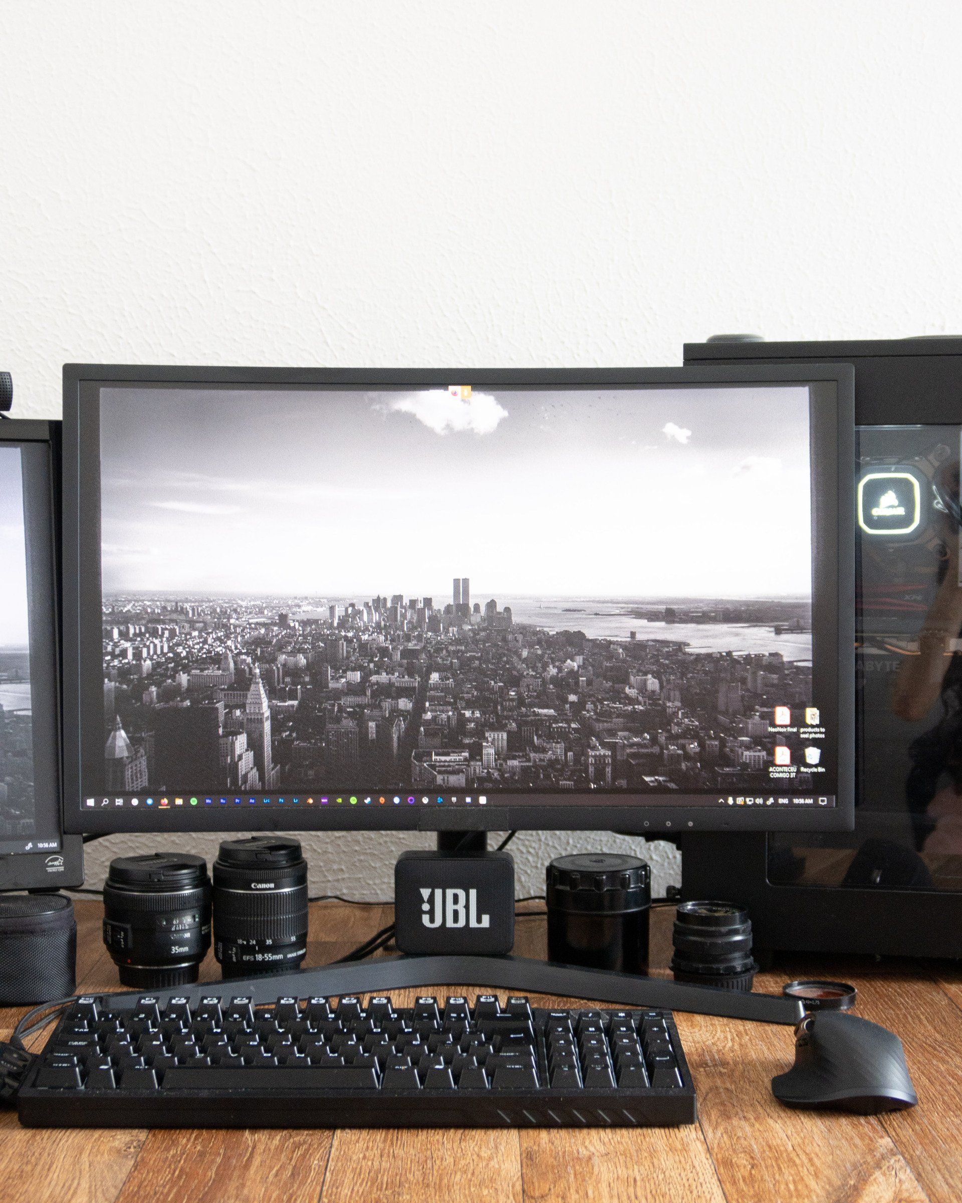 Picture of a desktop PC with a black and grey city skyline