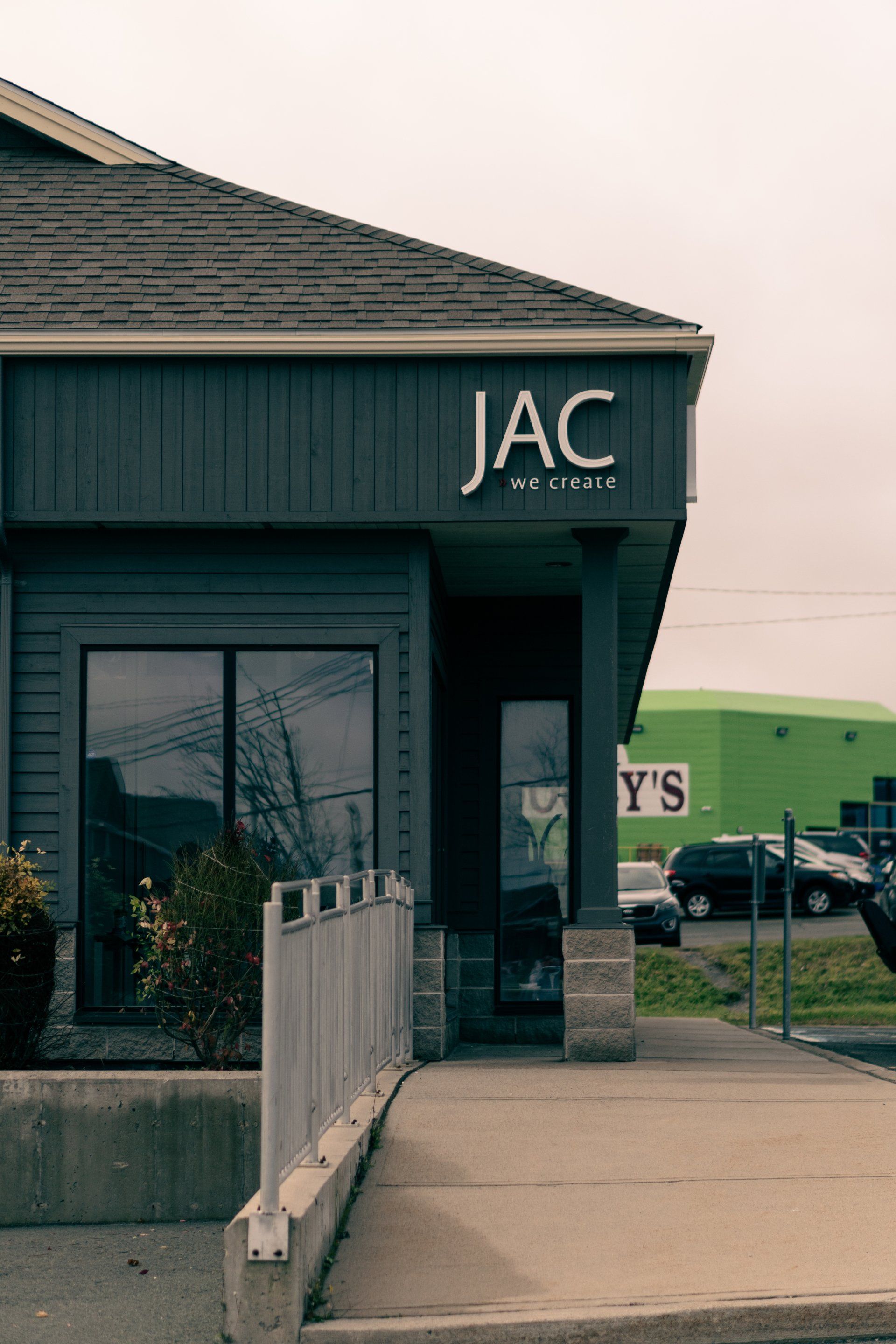 A black building with the word jac on it