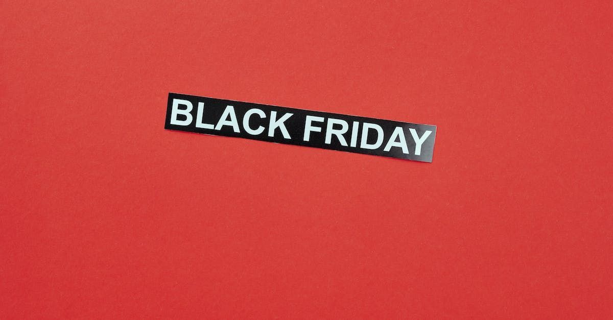 un cartello nero che dice black friday su sfondo rosso