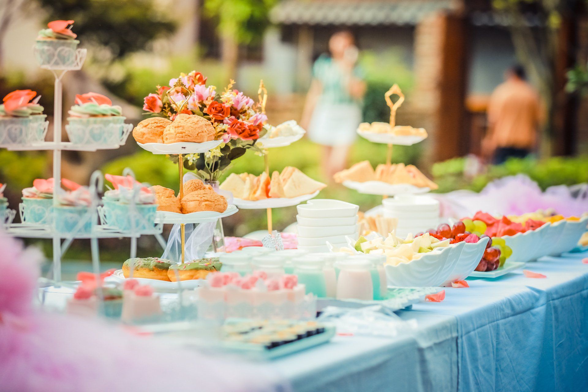 A table topped with a variety of desserts and cupcakes.