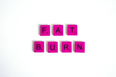 Fat Burner spelled with pink scrabble tiles