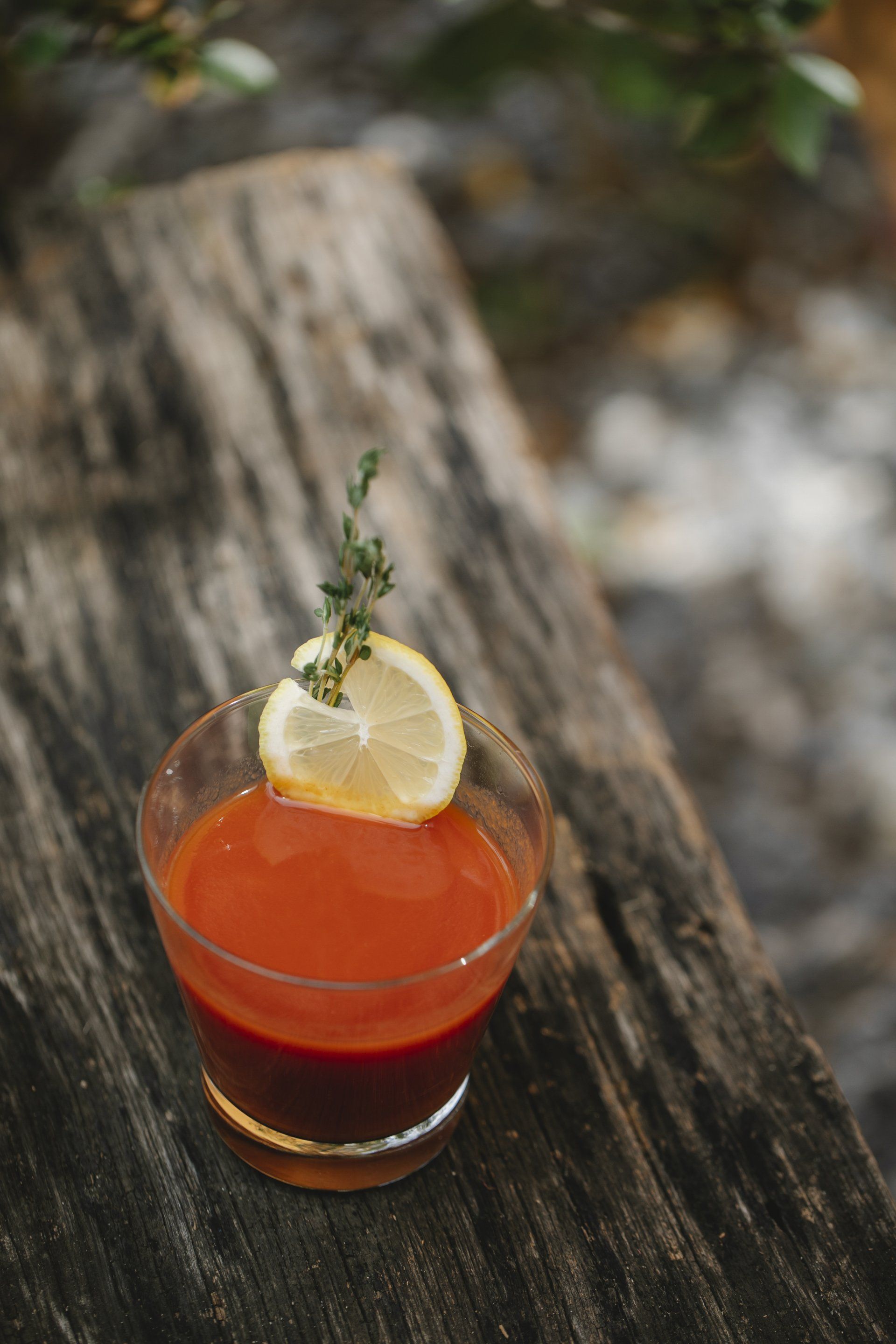 Red drink with a lemon