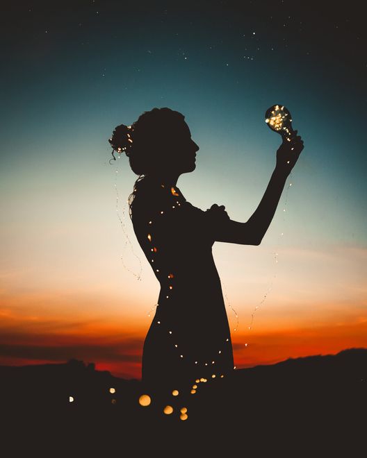 drawn image of woman silhouette with sparkles