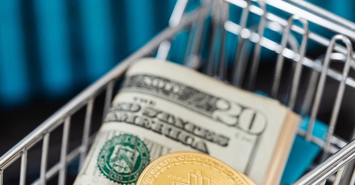 A shopping cart filled with money and a gold coin.