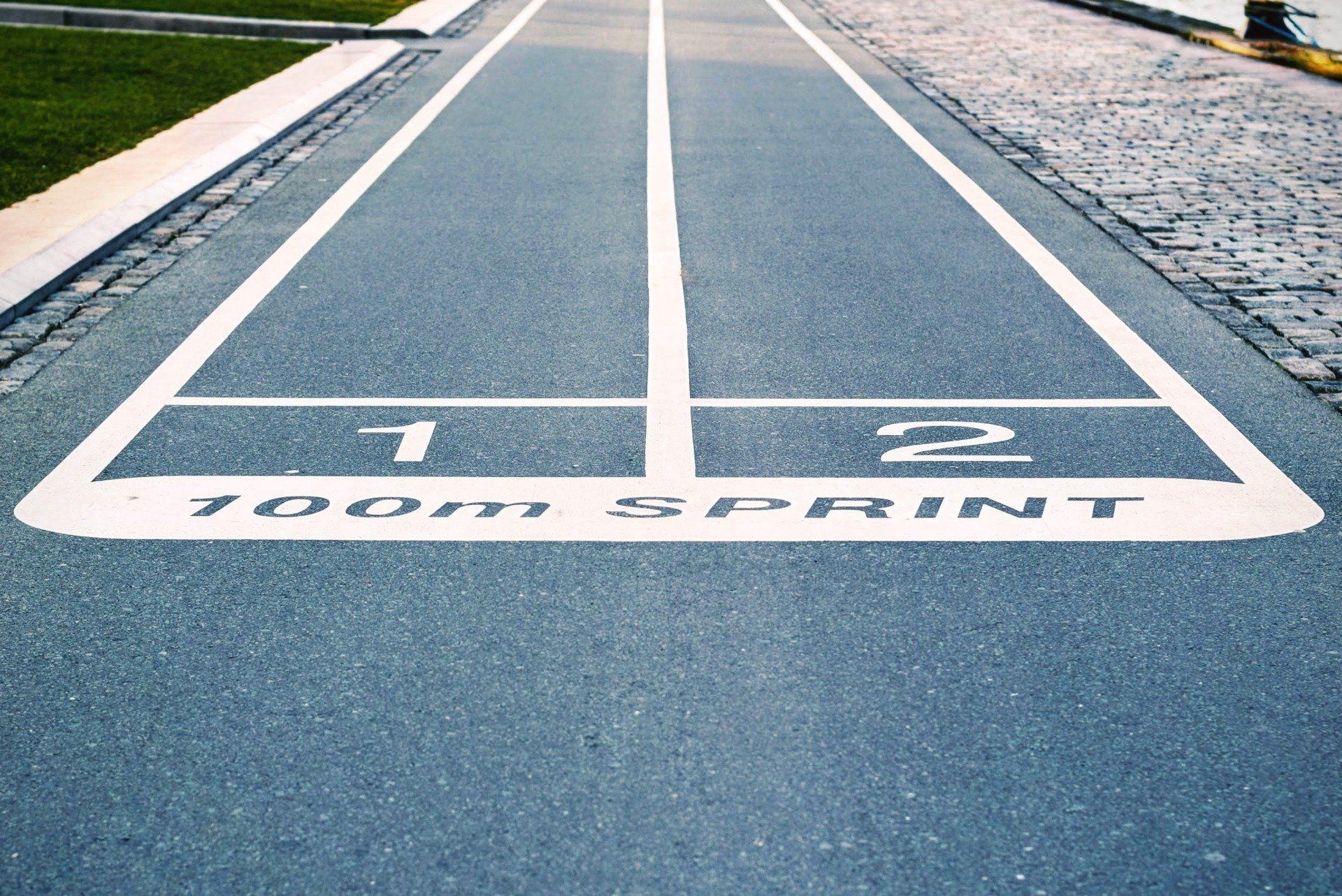 A blue athletics track that has two lanes