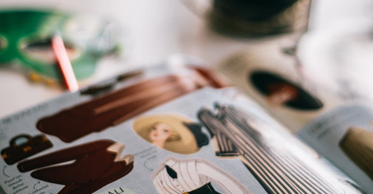 A magazine is open to a page with a woman in a hat on it.
