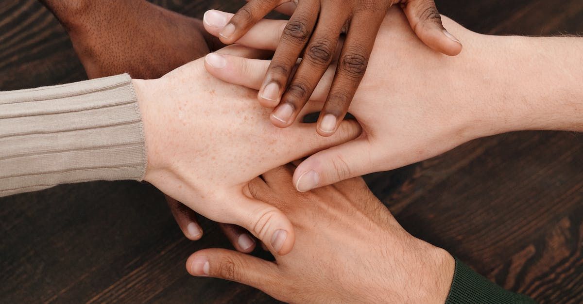 Hands of a diverse team