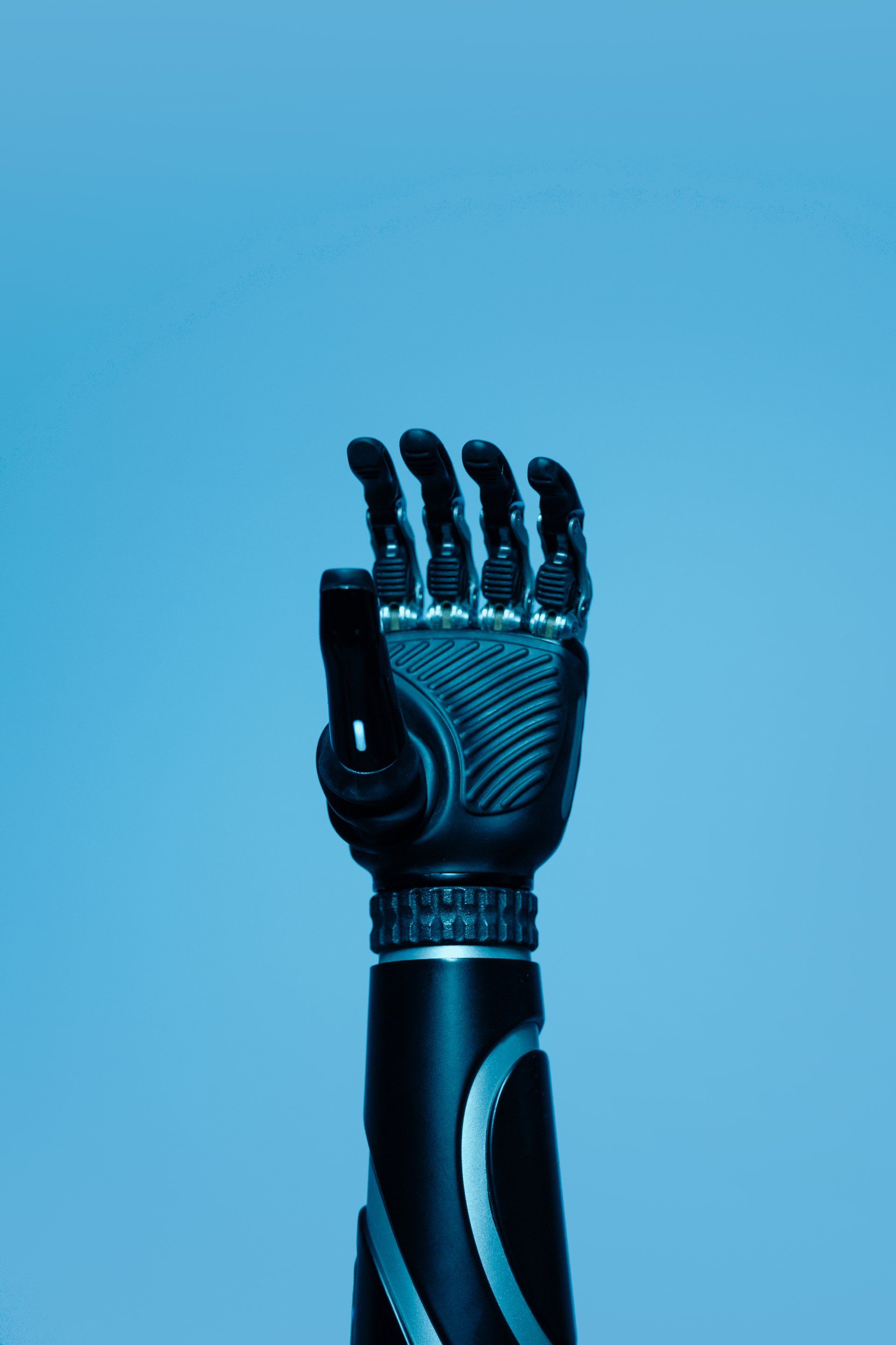 Robot hand with a blue background