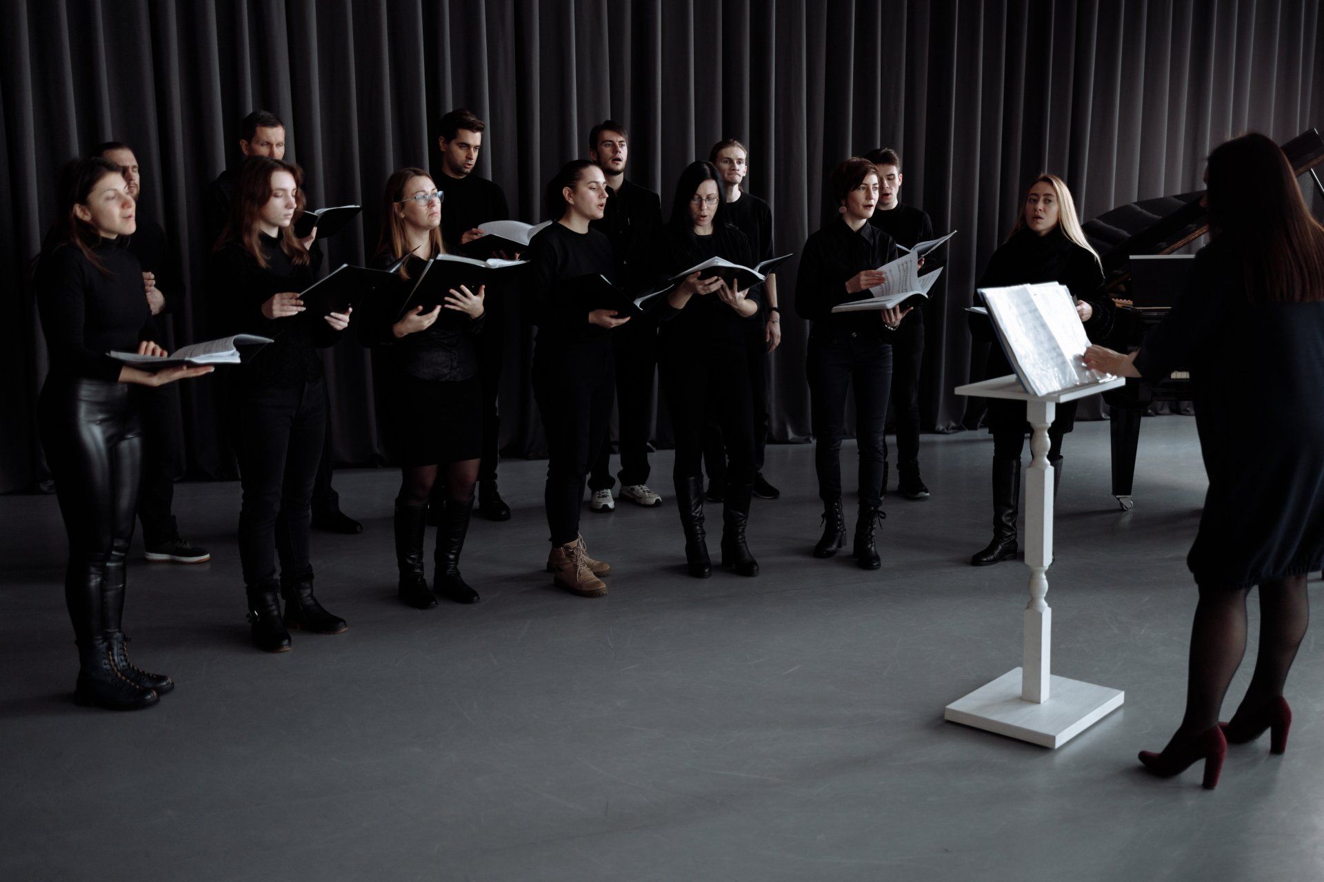 local choir stands together and sings during a live perfornance