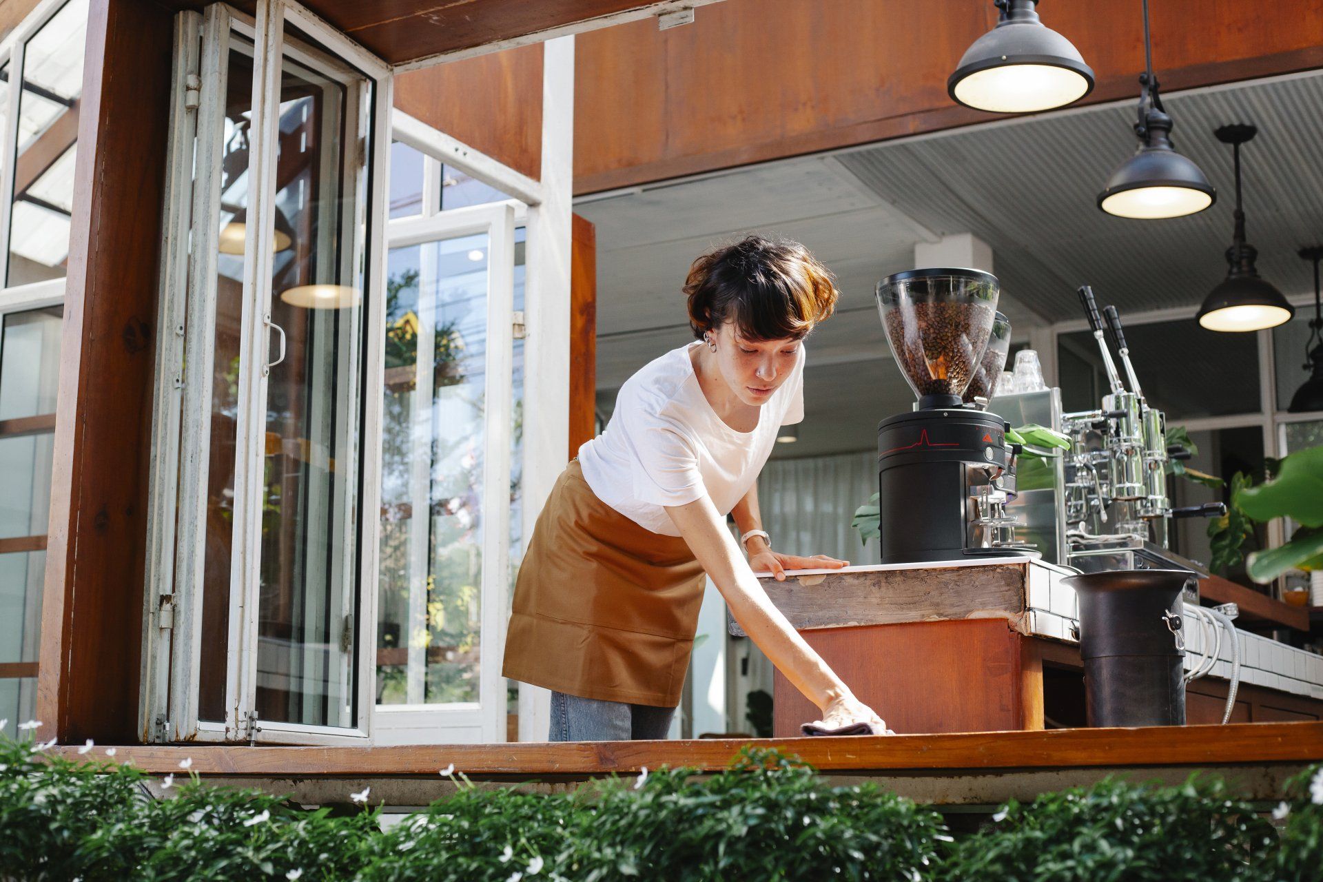 women cleaning a table in a restaurant