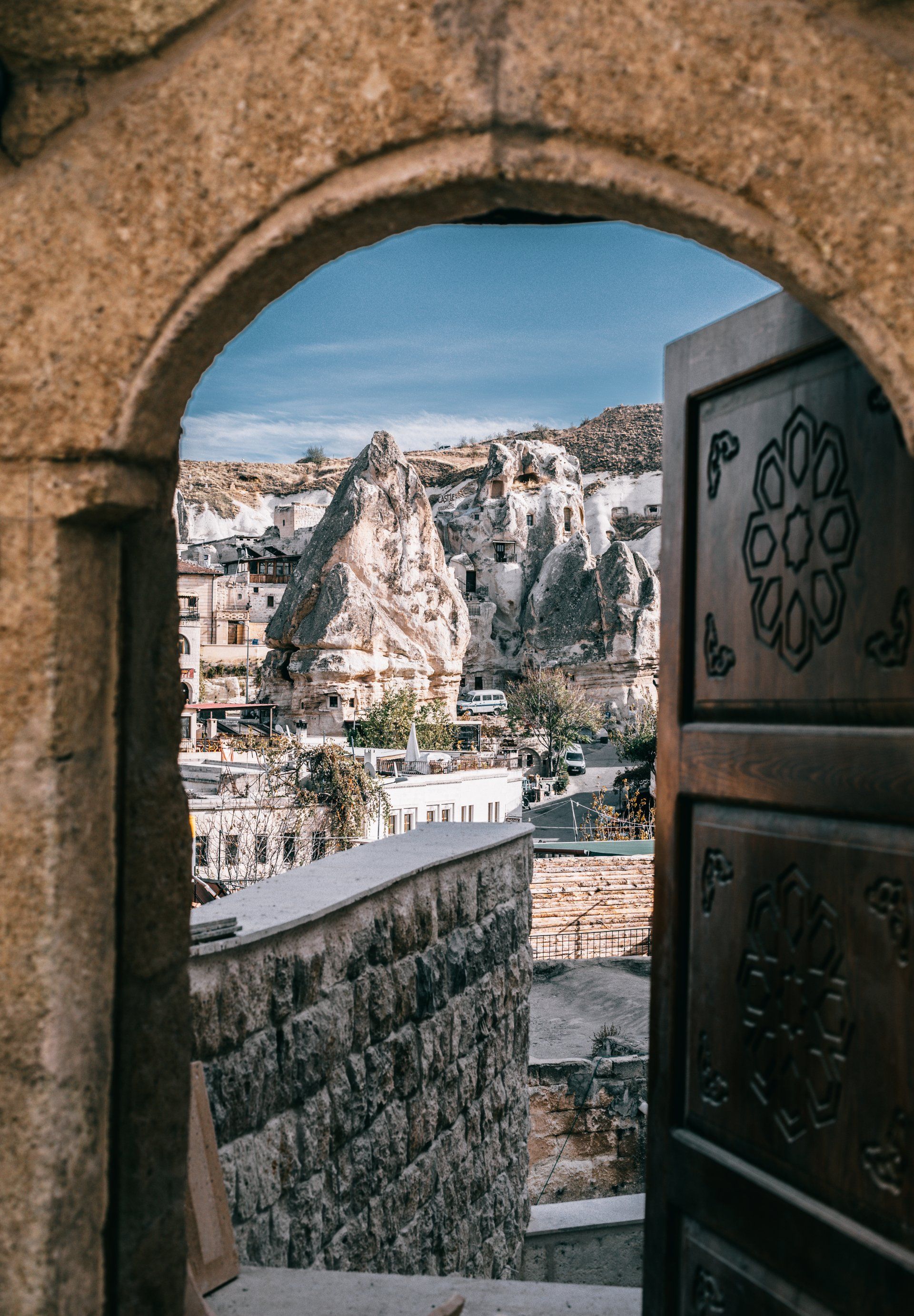 A door with a view of a city through it.