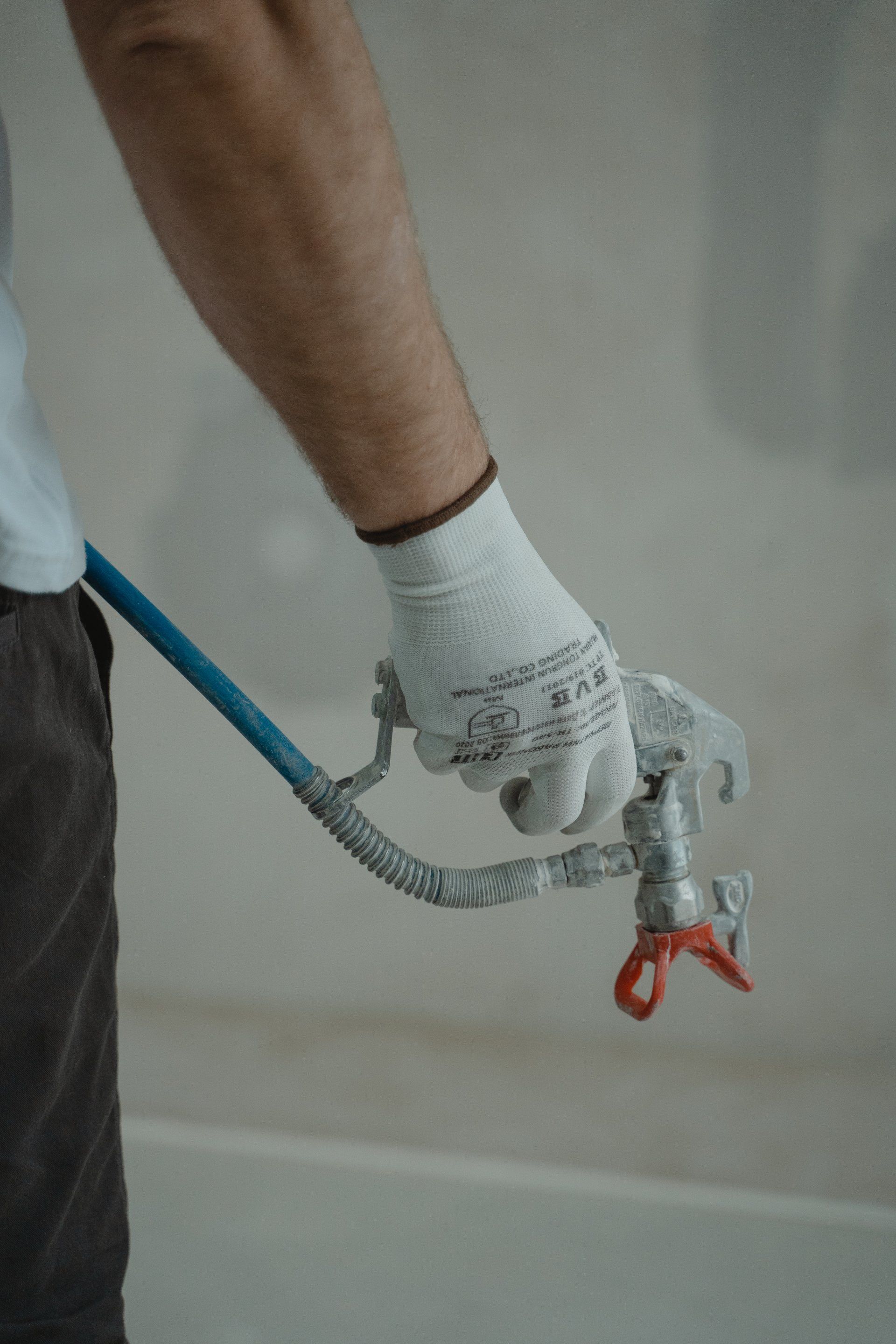 a plumber holding a plumbing tool