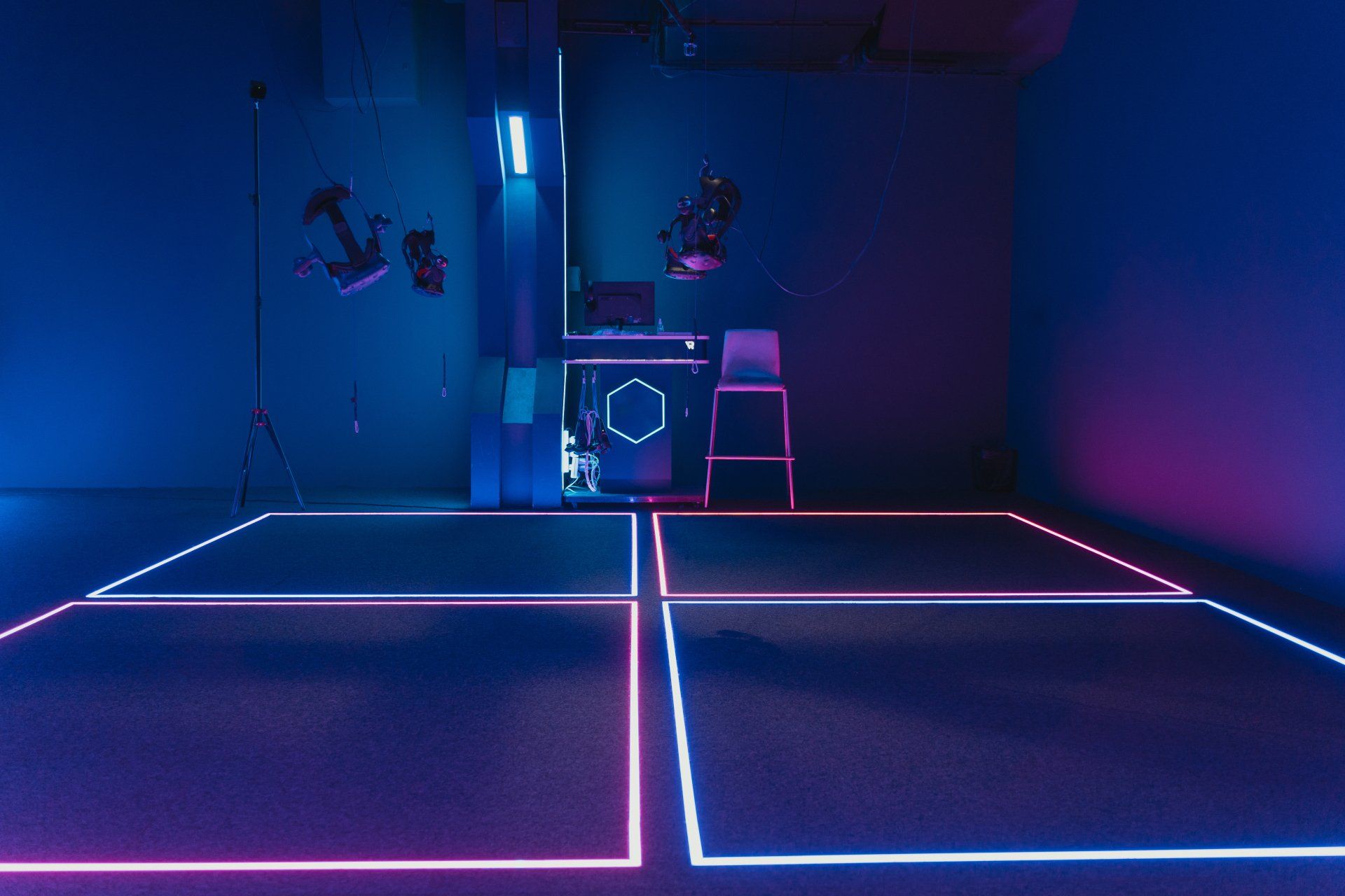 A room with a lot of neon lights on the floor and walls.