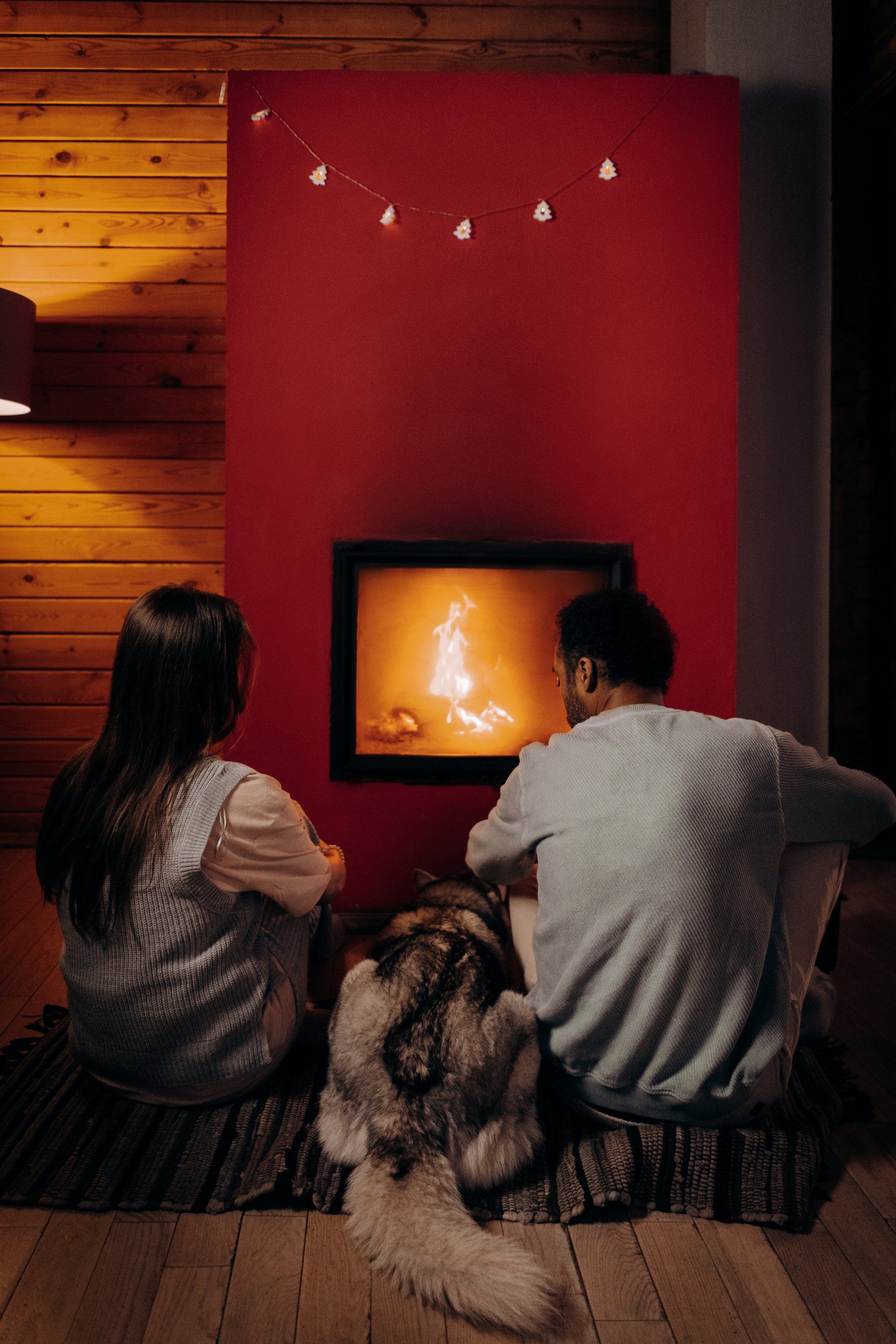 couple in front of fireplace