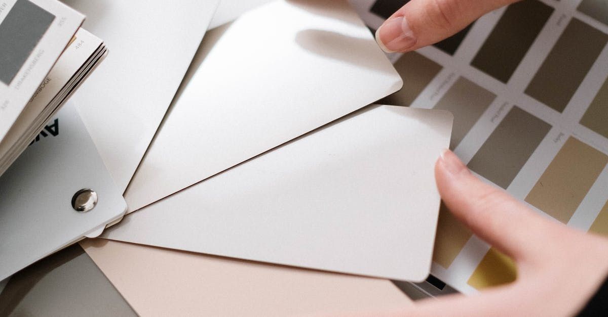 A roof with a lot of shingles on it and trees in the background.