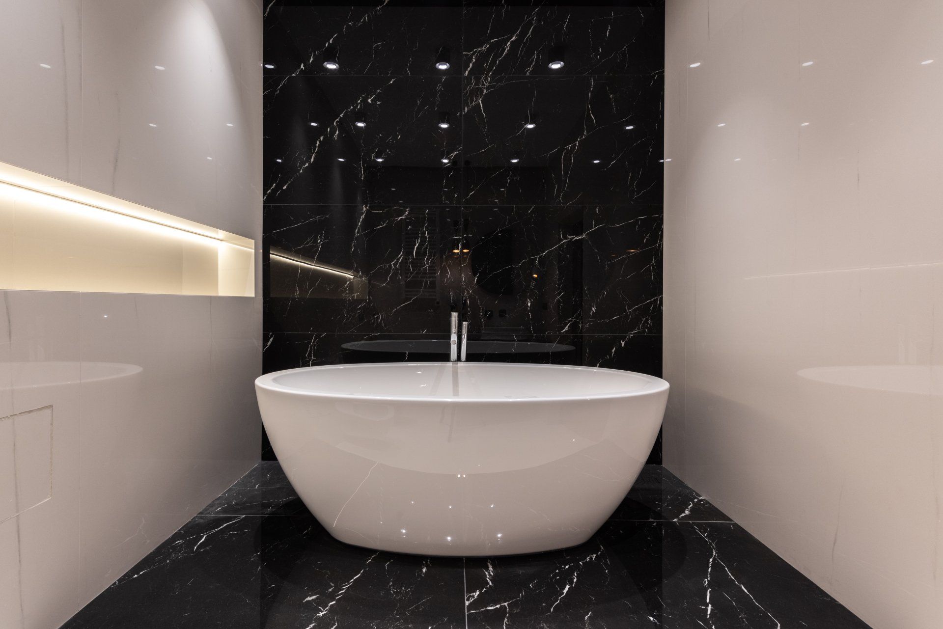 there is a bathtub in the middle of the bathroom . Bathroom Remodeling Trends for 2024