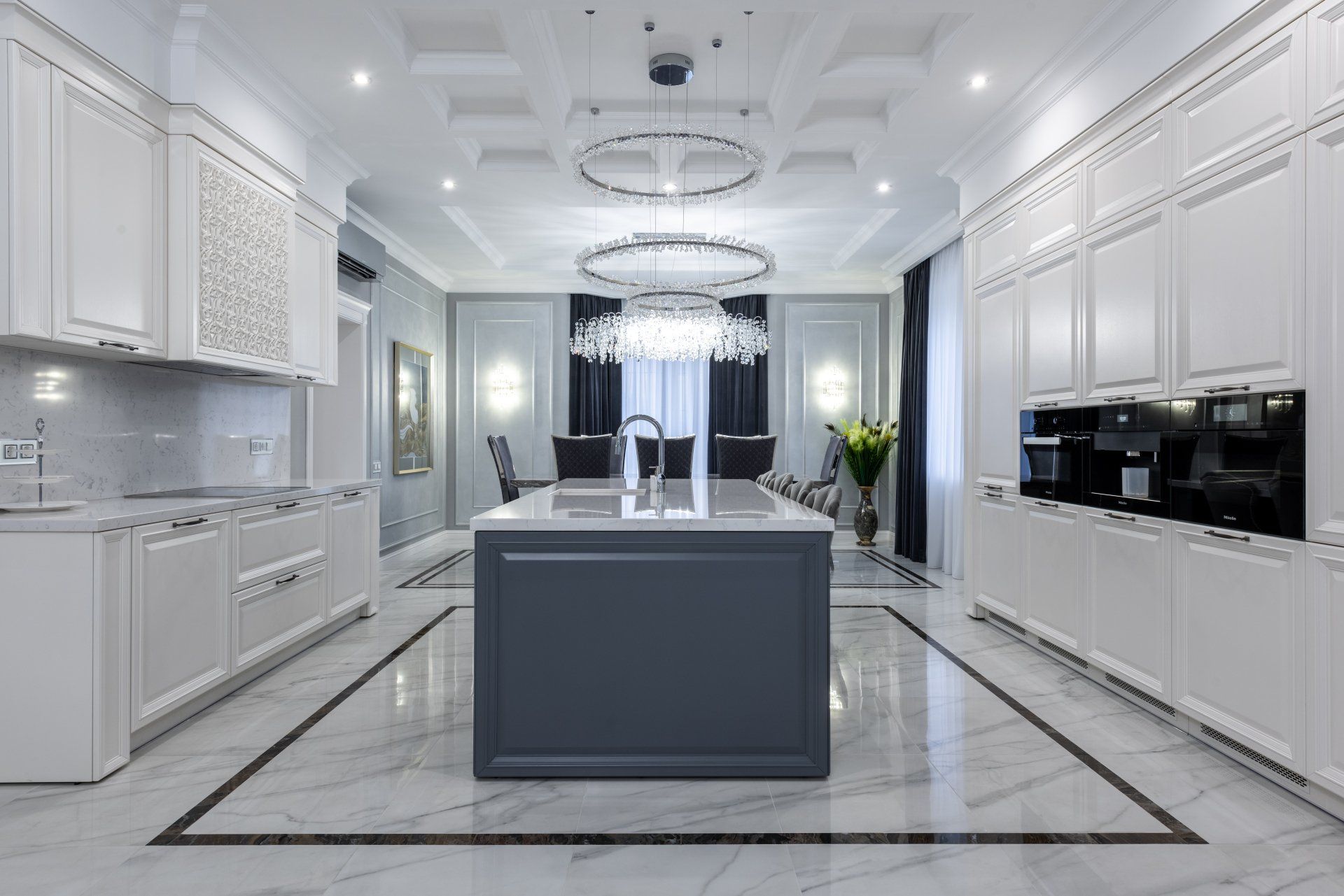 spacious white, modern kitchen with sparkly gray marble floors