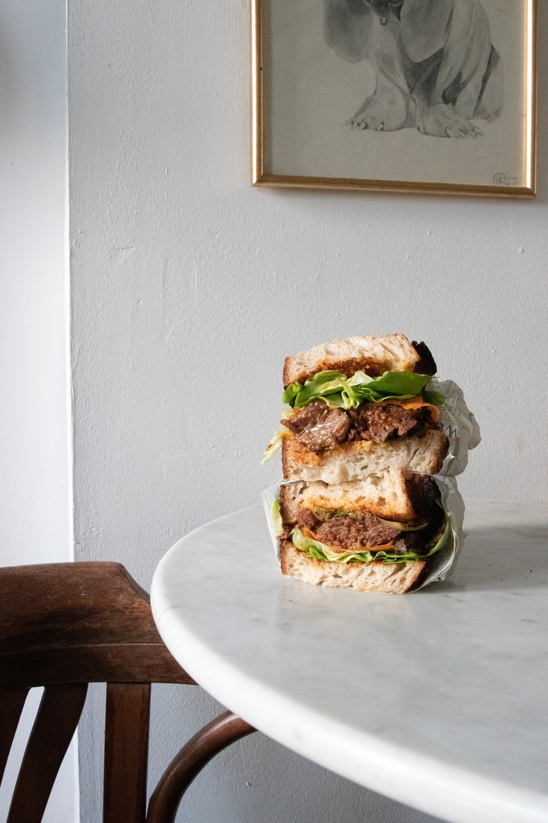 a sandwich is stacked on top of each other on a table .