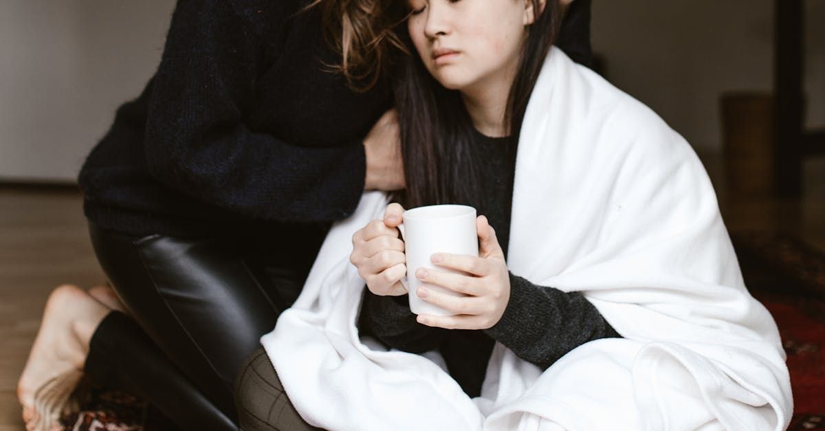A Group of Young Girls Are Drawing on a Large Piece of Paper