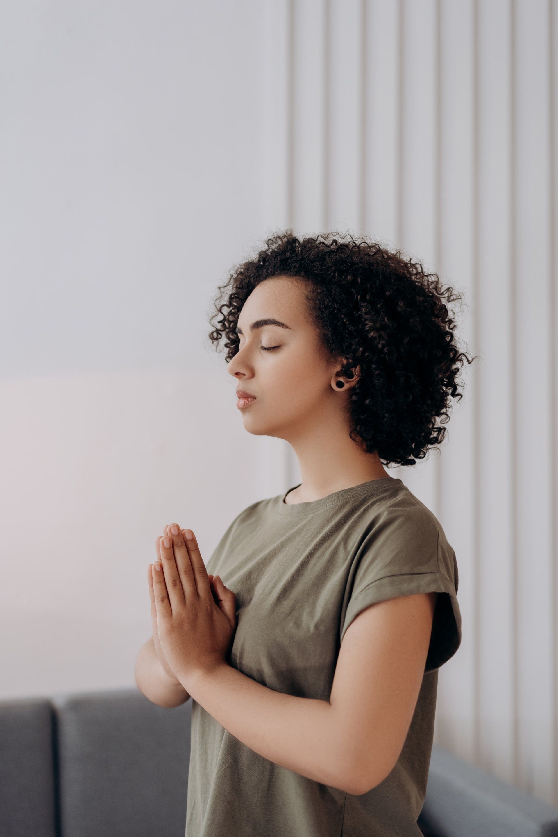 Woman at peace in prayer position