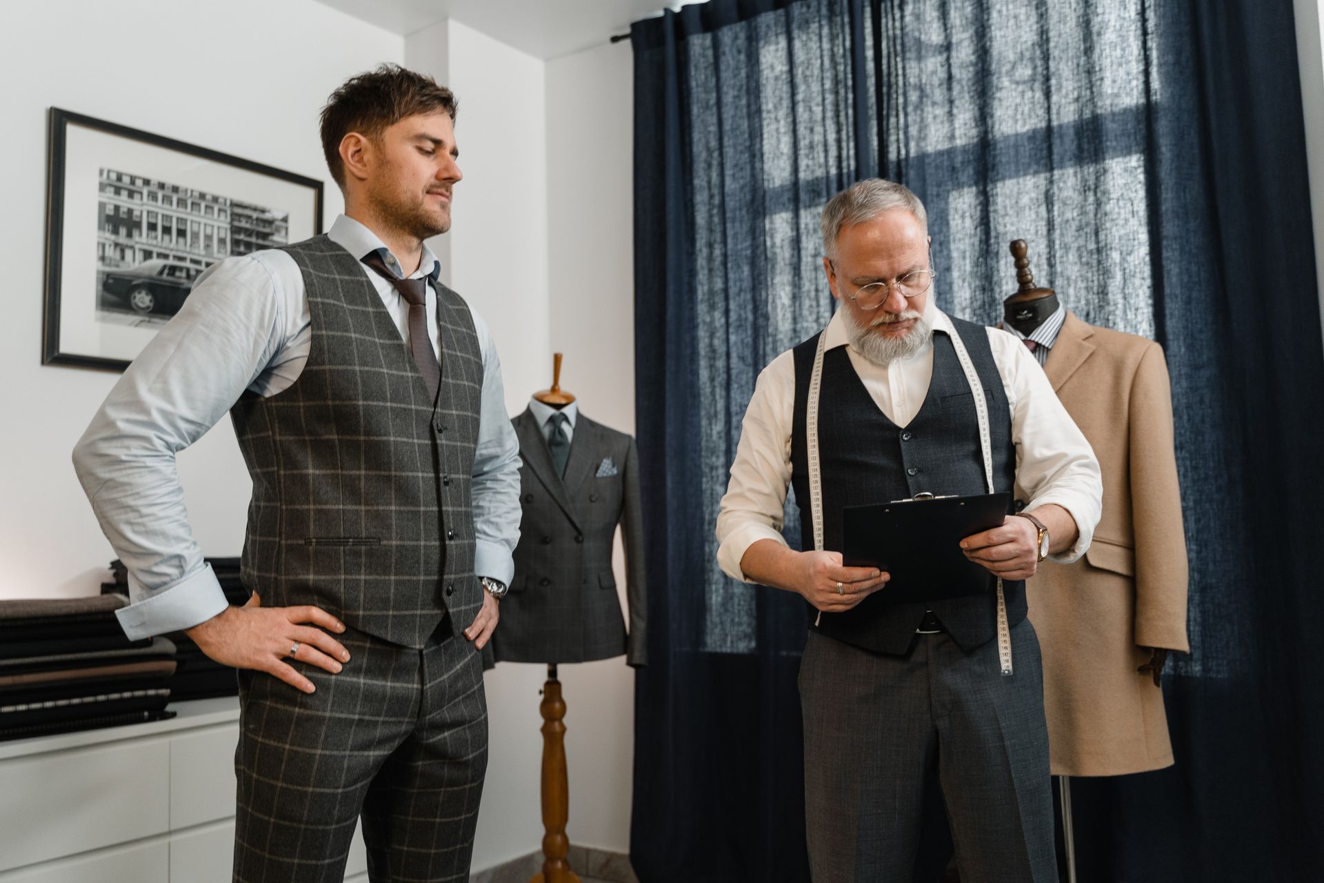 A suit tailor and client