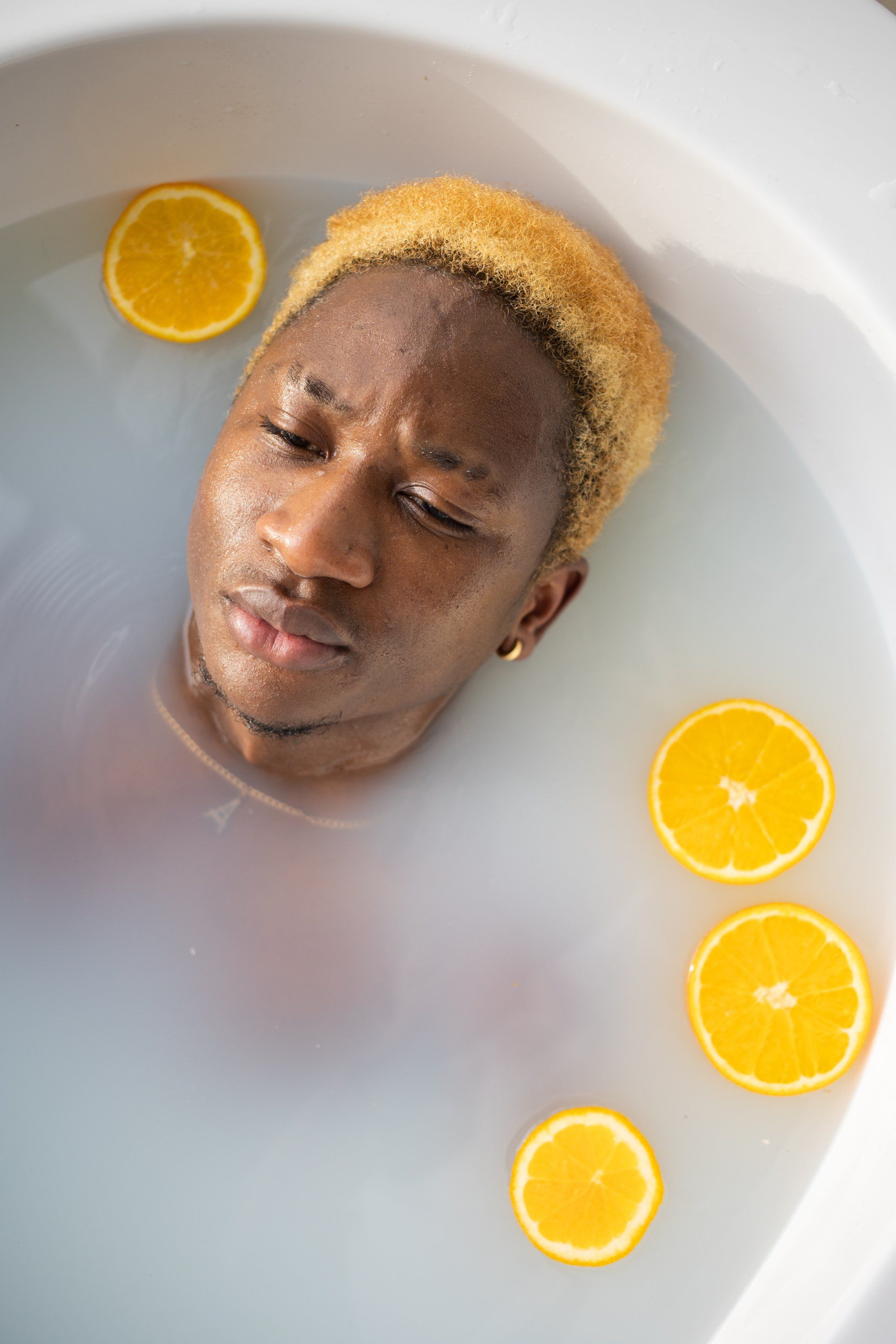Man in bath with orange slices