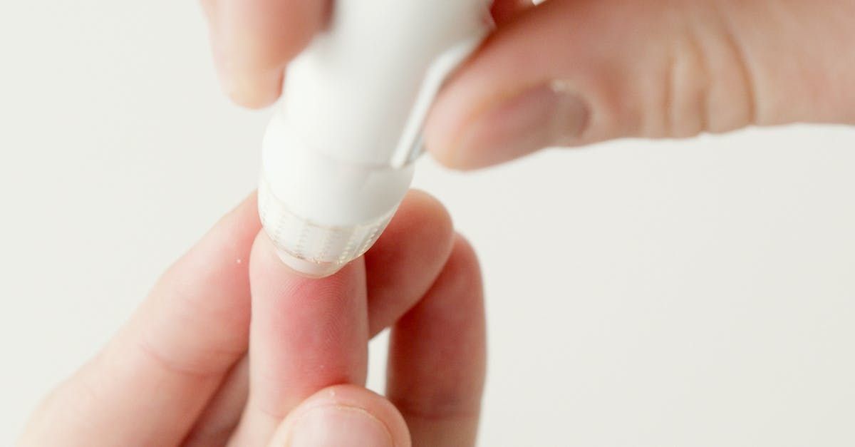 a diabetic instrument being pressed agains a finger