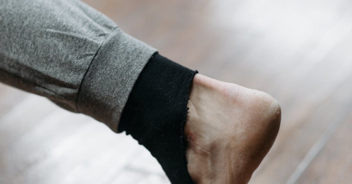 a close up of a person 's foot wearing a pair of black socks .